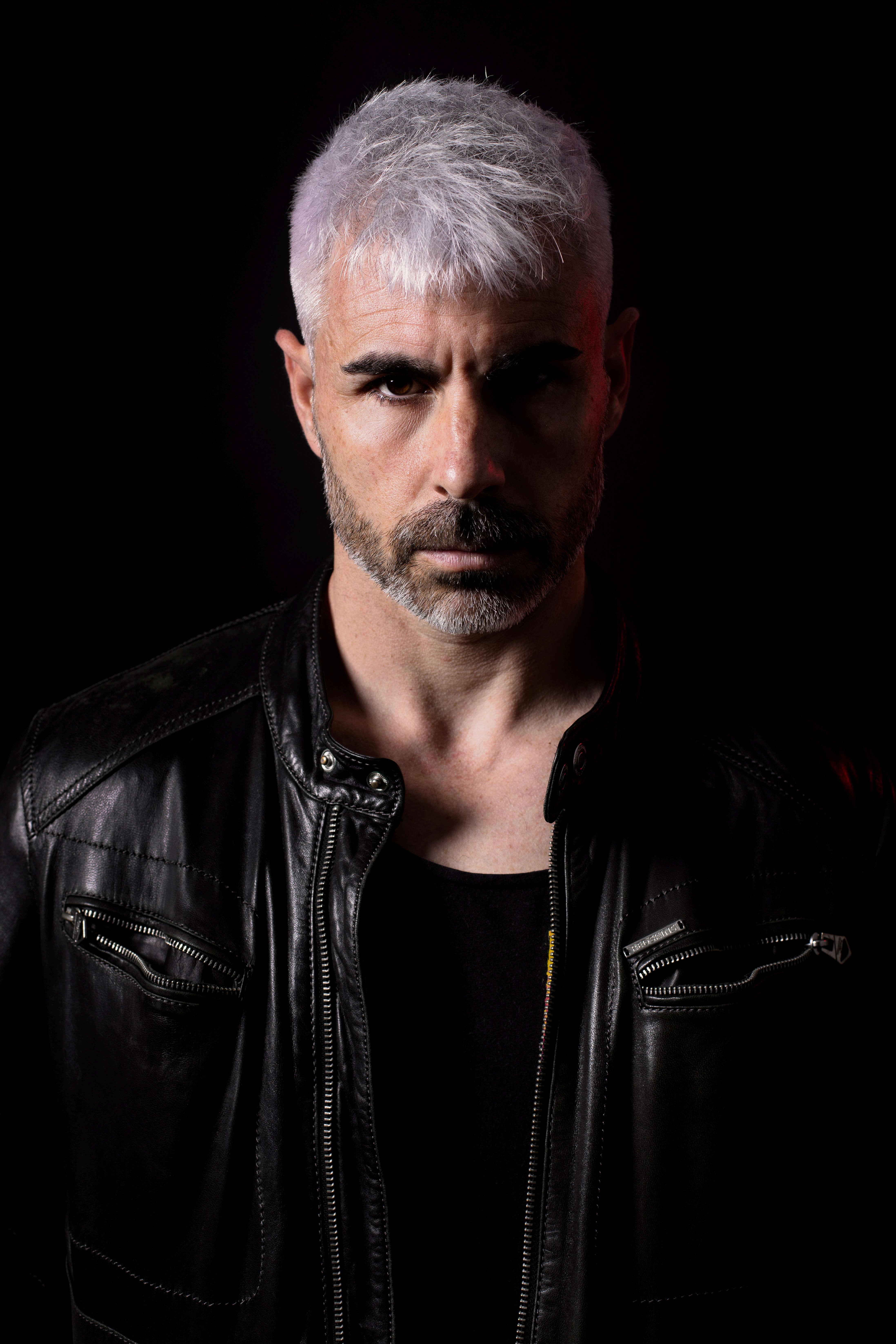 Music producer sitting in his studio