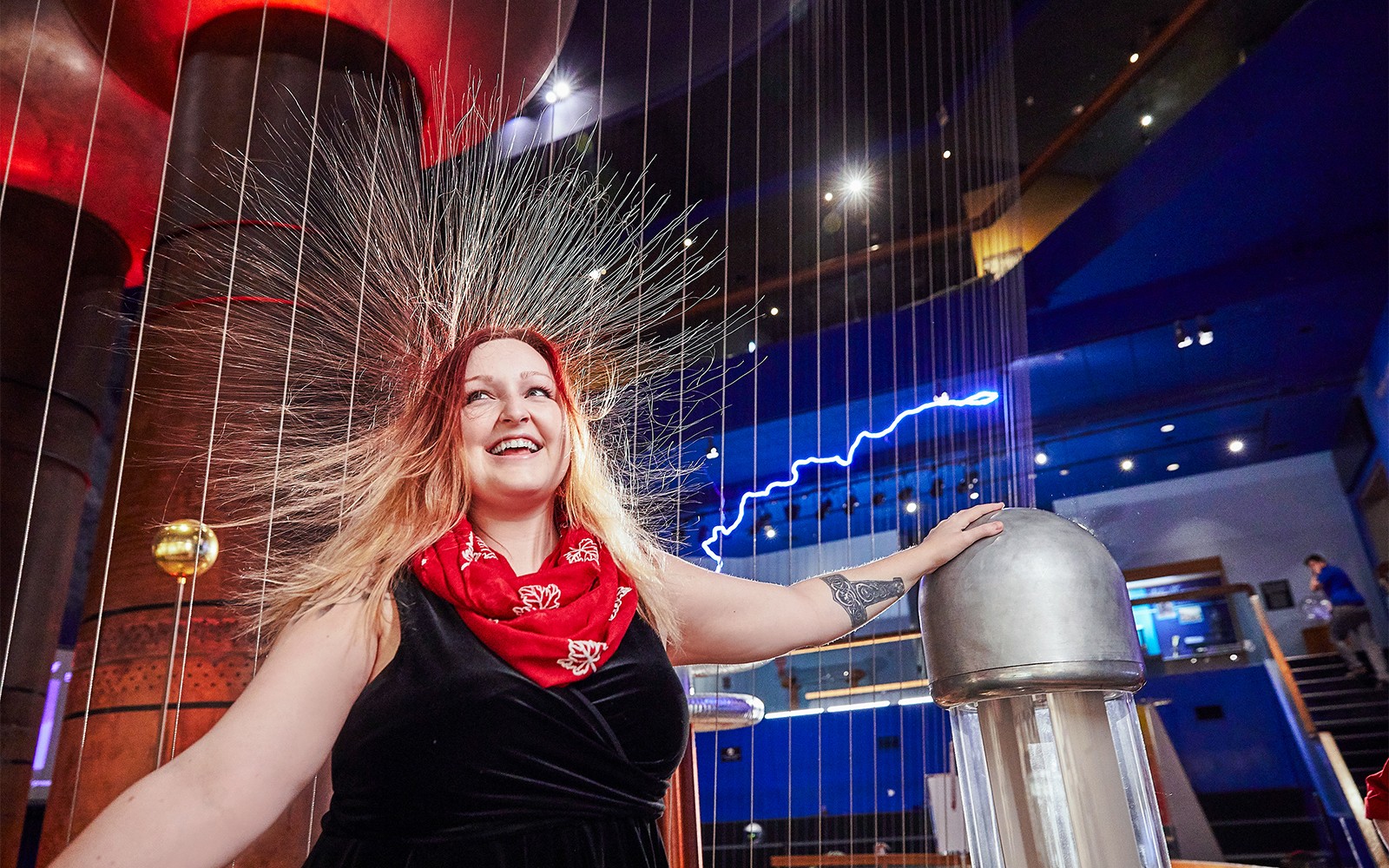 Woman experiencing static electricity at Museum of Science Theater of Electricity, Boston.