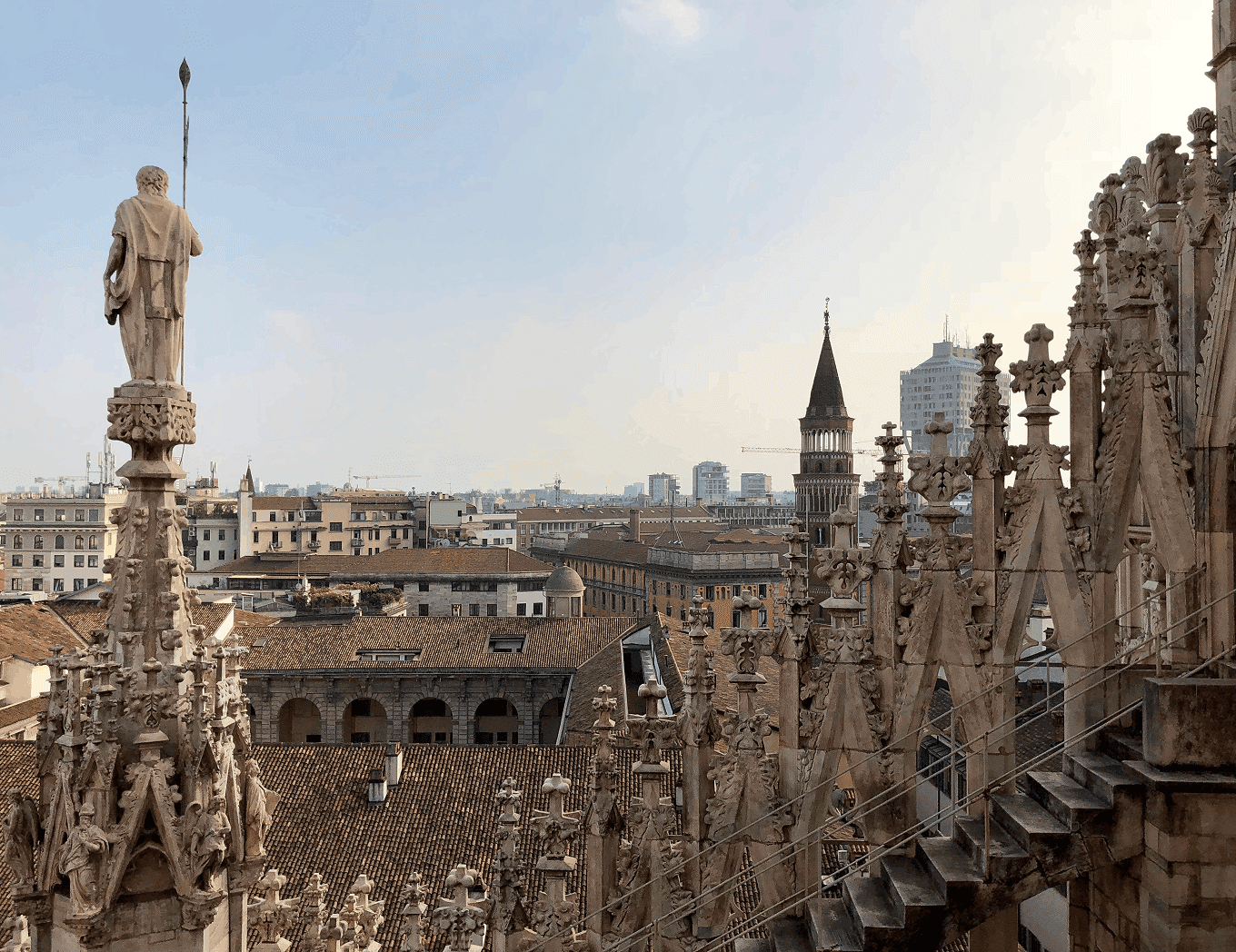 View of Milan Cathedral's gothic spires and rooftop sculptures