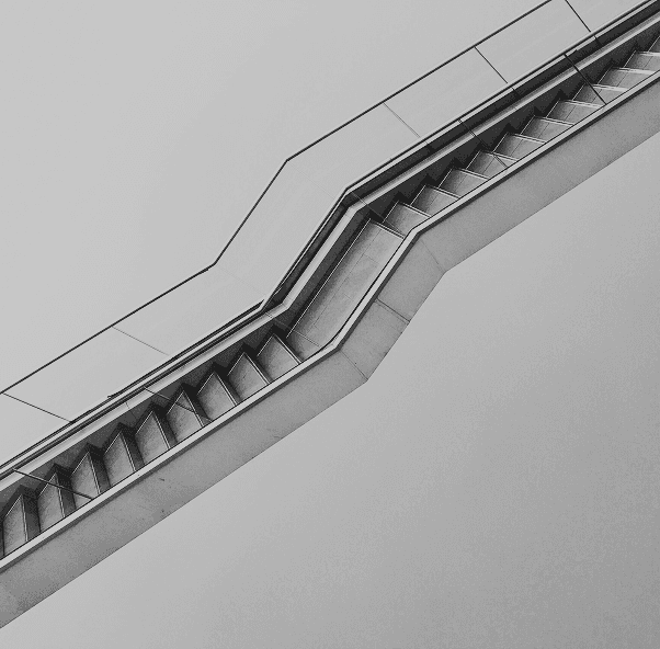 An abstract image with soft, out-of-focus light circles against a dark background.