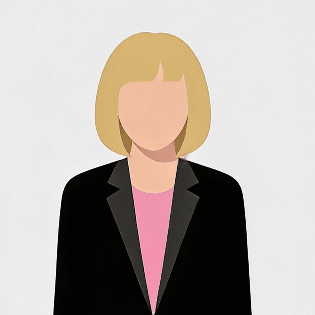 Amy standing by a window in an office