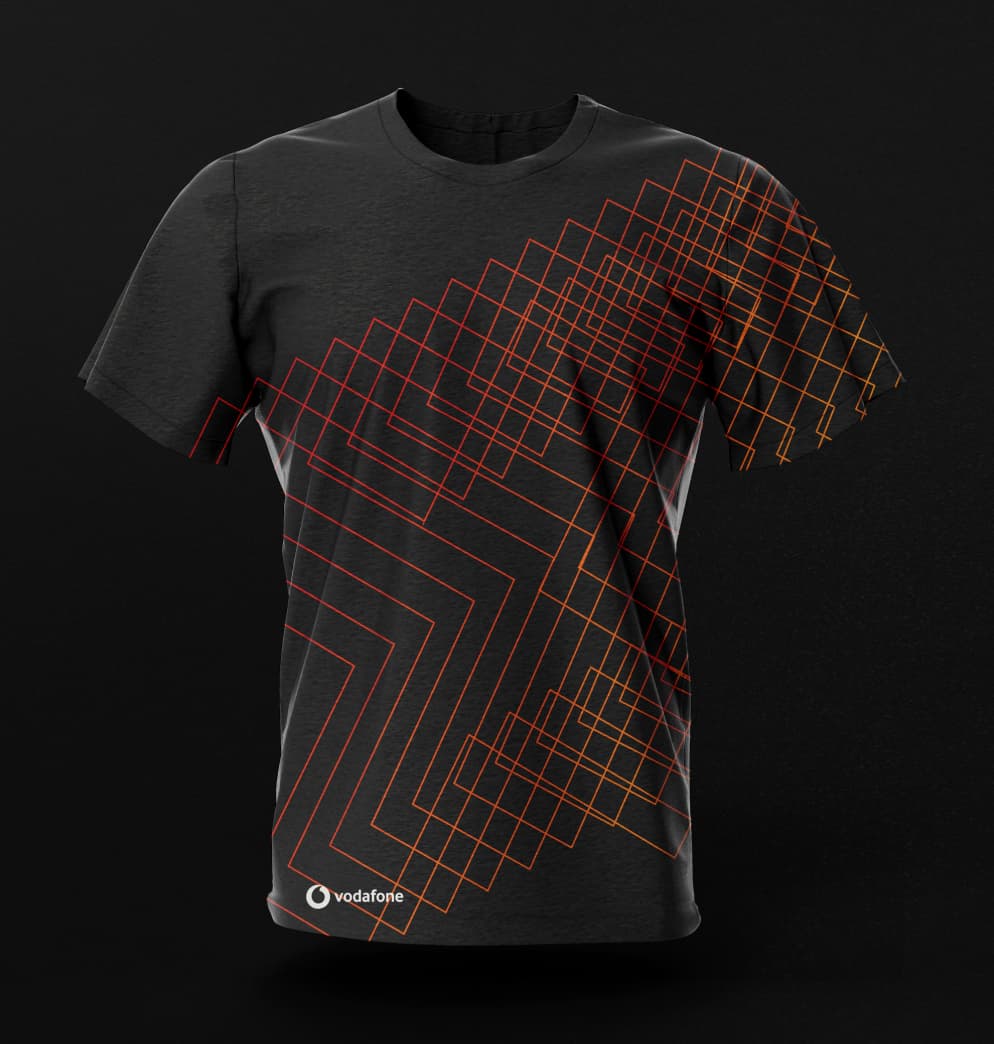 Black staff t-shirt featuring a geometric orange wireframe pattern and the Vodafone logo, designed for the internal engineering team.