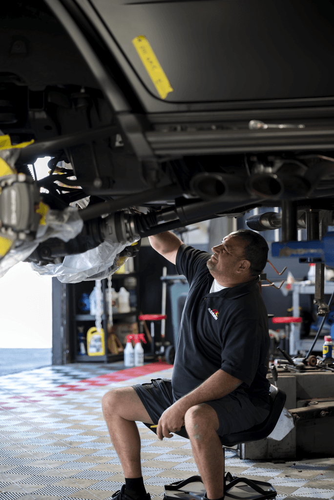 picture of a man painting a caliper