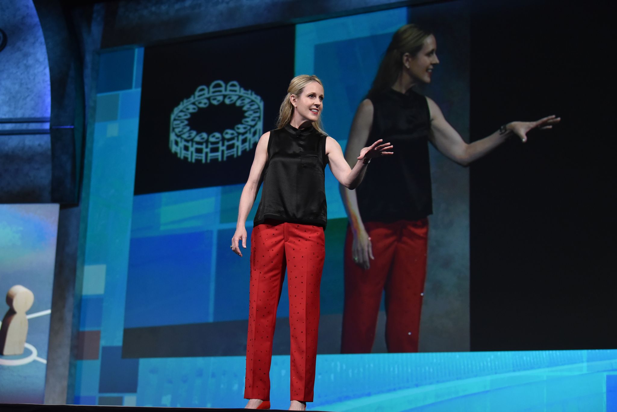 Woman giving a presentation on stage