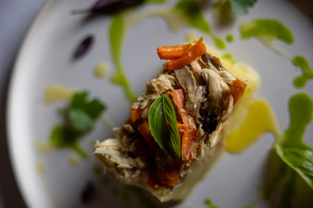 A table is set for a meal by the window.