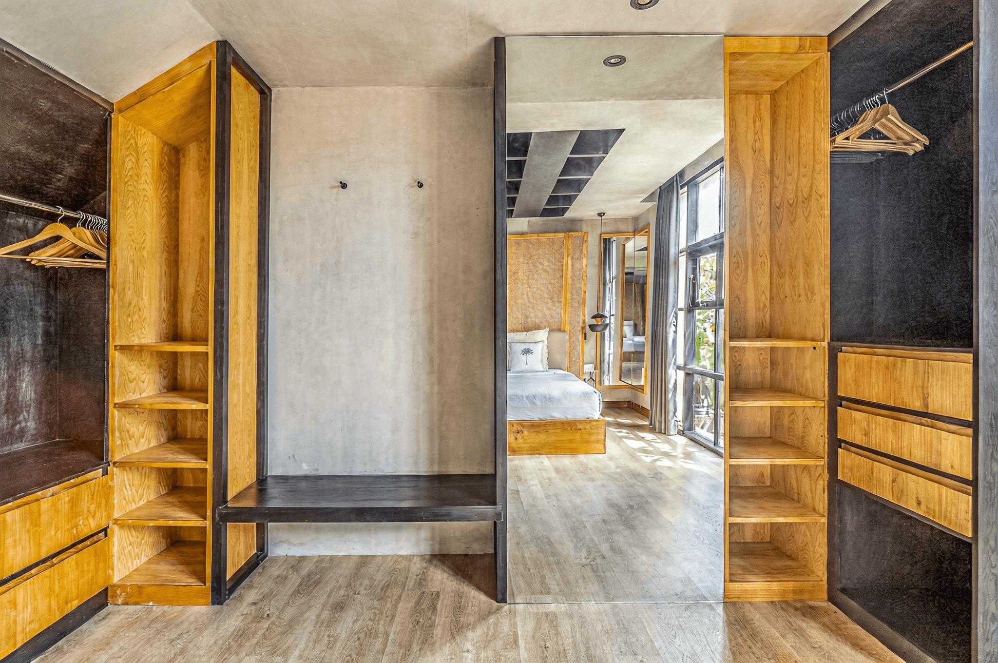 Custom wooden wardrobe and dressing area in a Bali villa. Top real estate agent for high-end Canggu real estate.