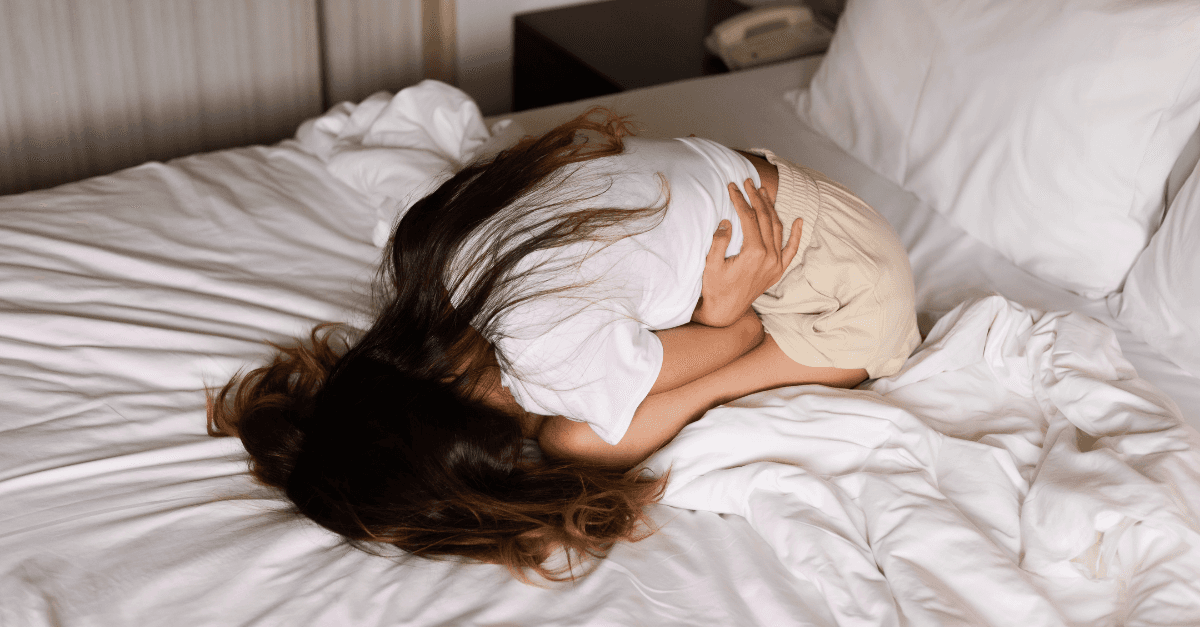 Women holding the belly since PCOS and low in omega 3