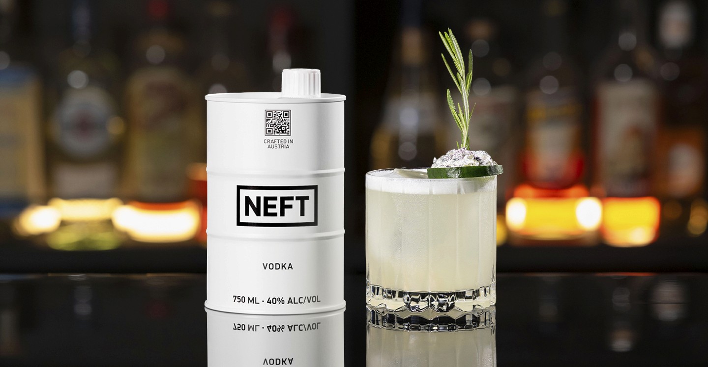 A NEFT Barrel and a glass of Starry Night on a bar counter.