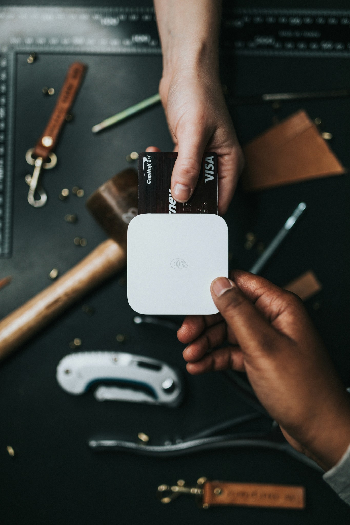 Stock photo: a craftsperson accepts digital payment for their product