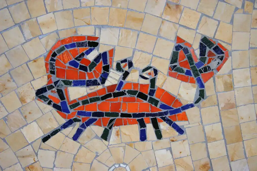 Mosaic mural of a crab at San Diego Airport, celebrating Pacific Ocean themes with vibrant tiles.