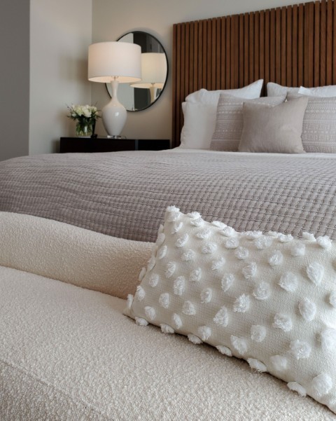 Image of Luxurious bedroom interior design featuring plush furniture, bedding, and layout design by KHD Homes.