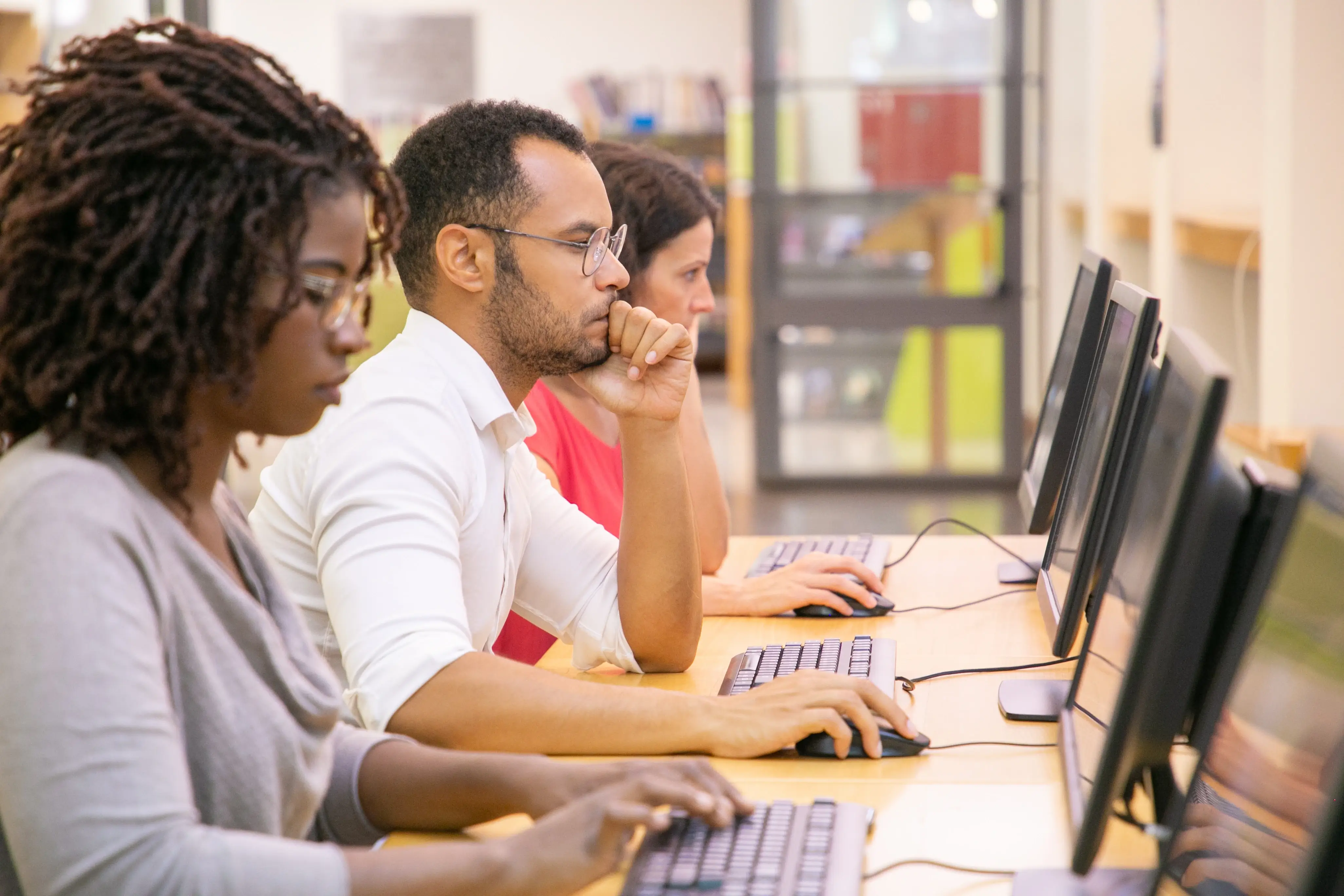 Adults studying in classroom