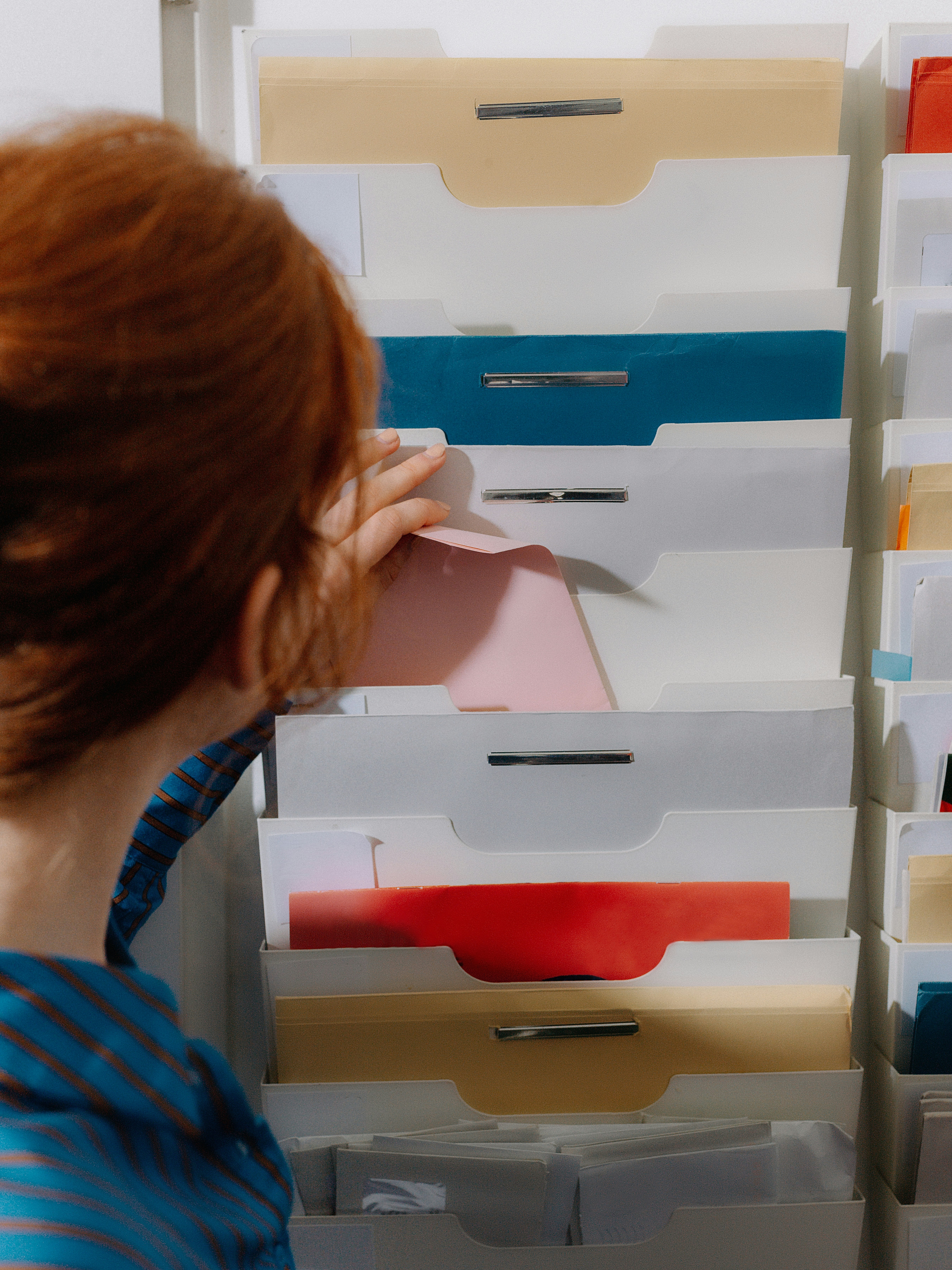 person using a filing system