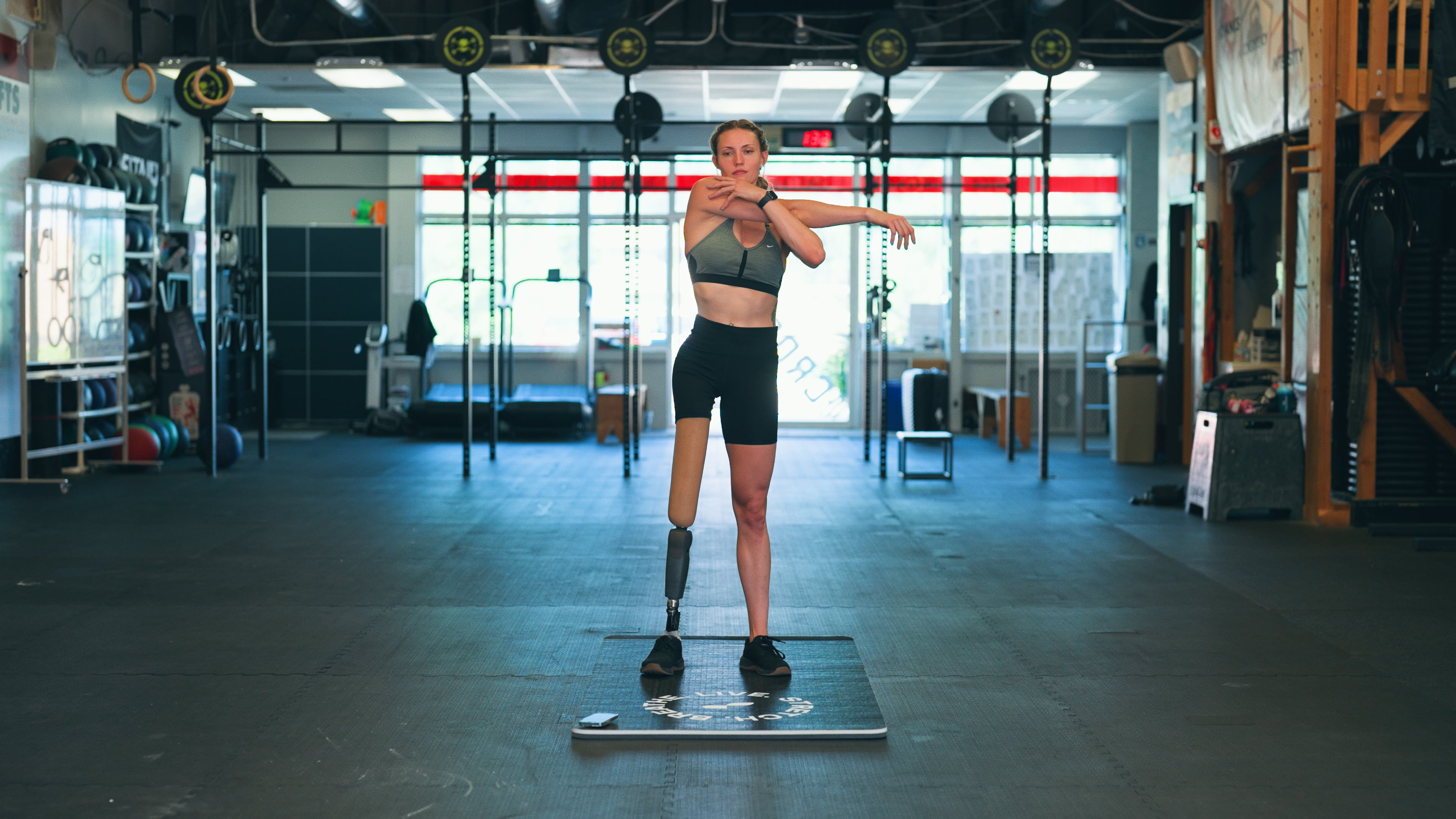 Woman Stretching in Gym - Wrist Mobility Exercises