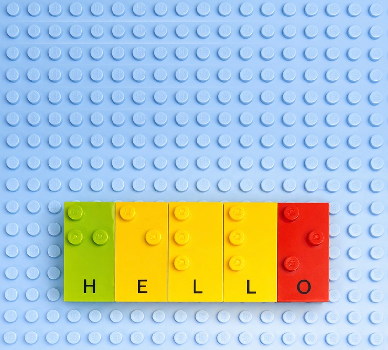 Colourful Braille lego blocks spelling the word hello