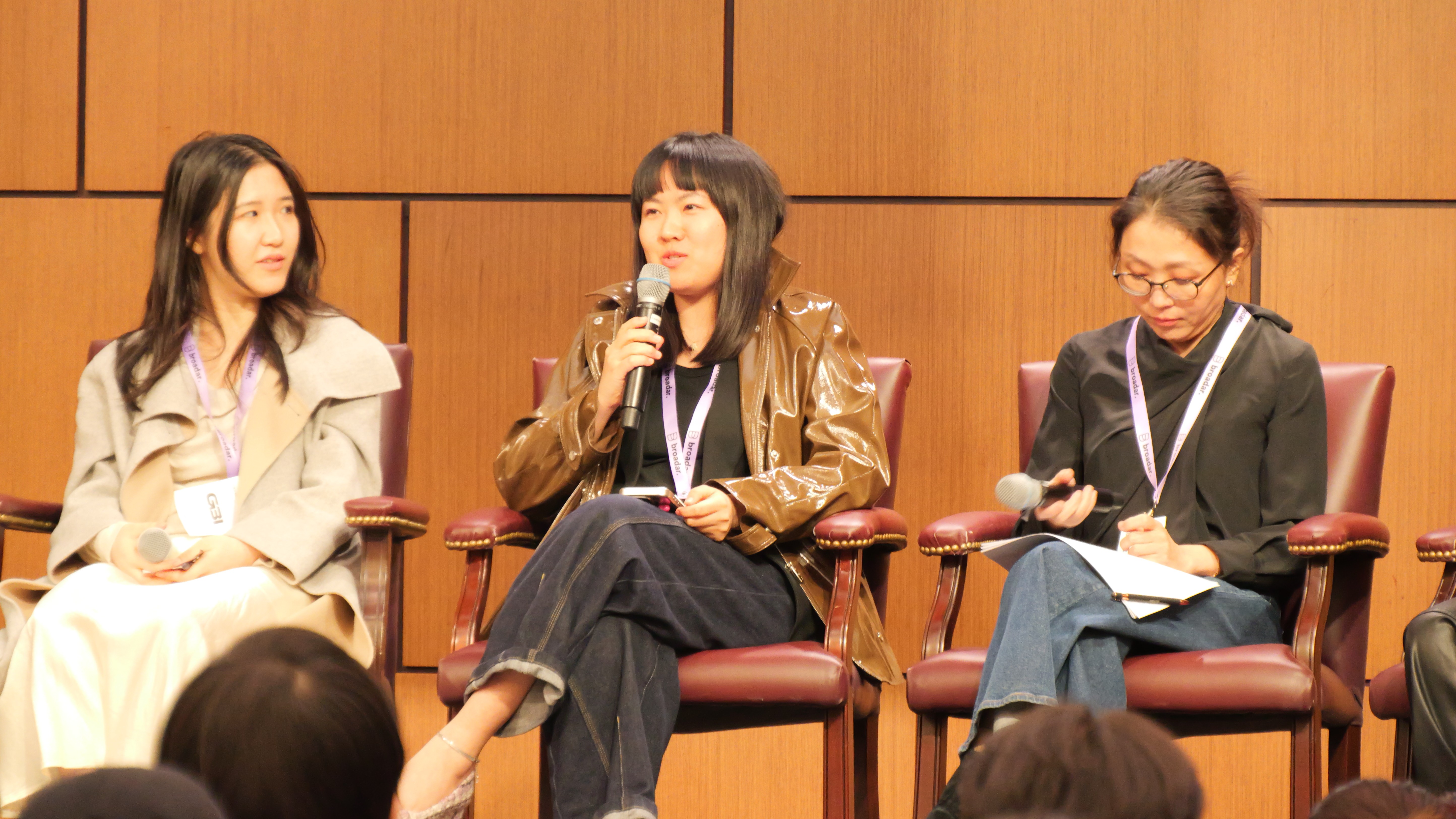 a young boy holding a box of food