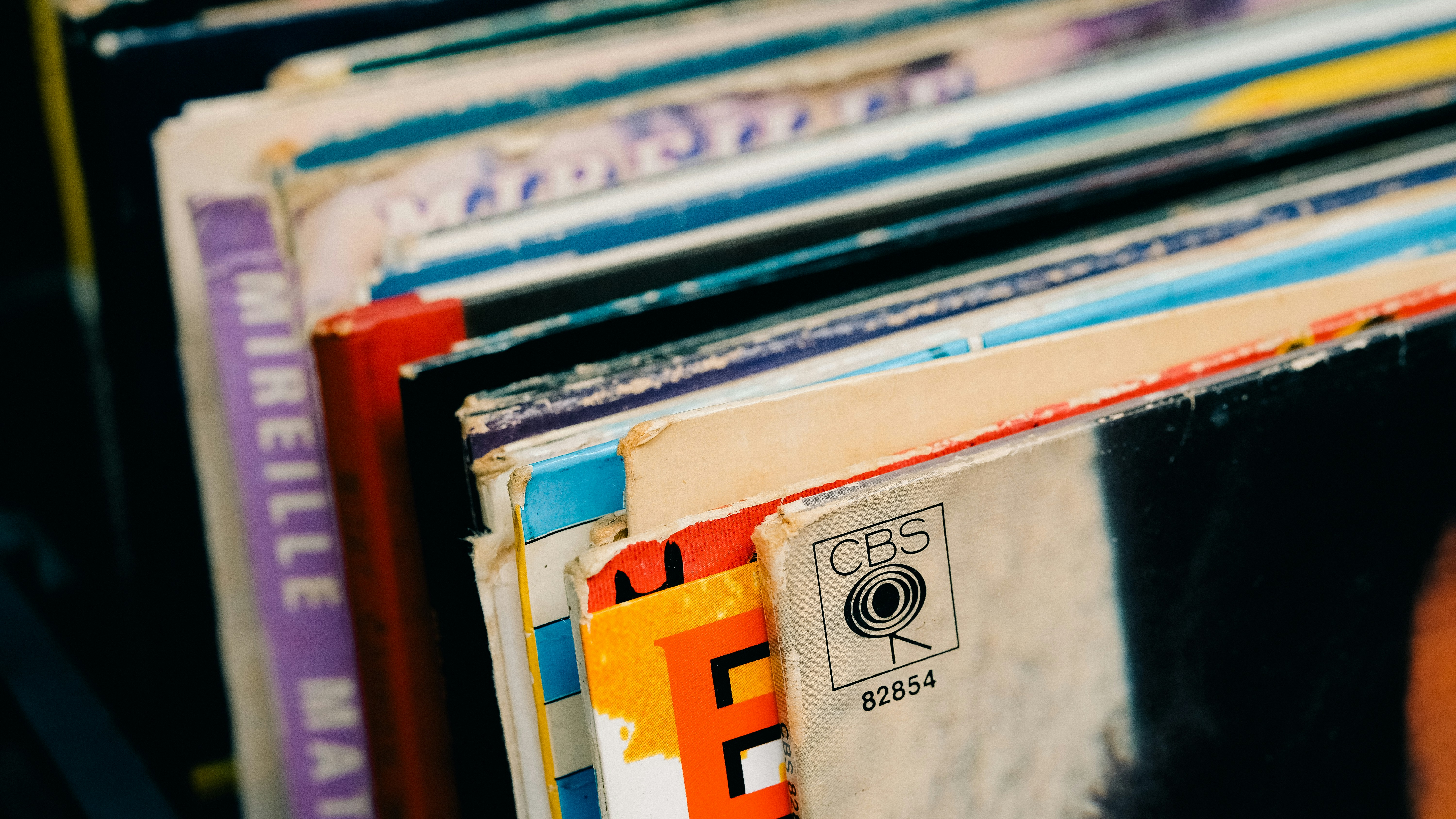 A close up of a stack of records