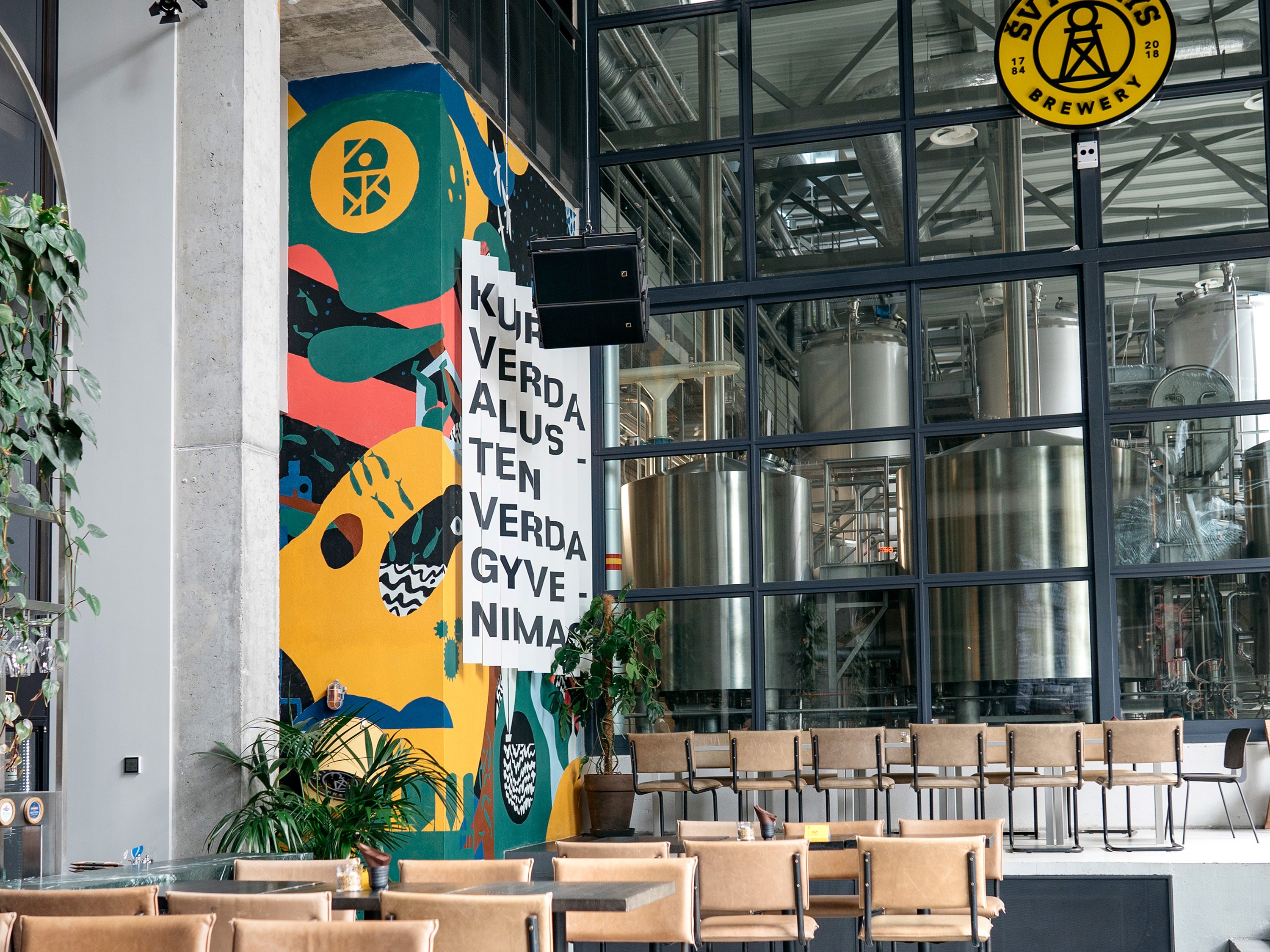 Large brewery mural illustrating brand storytelling through wall art