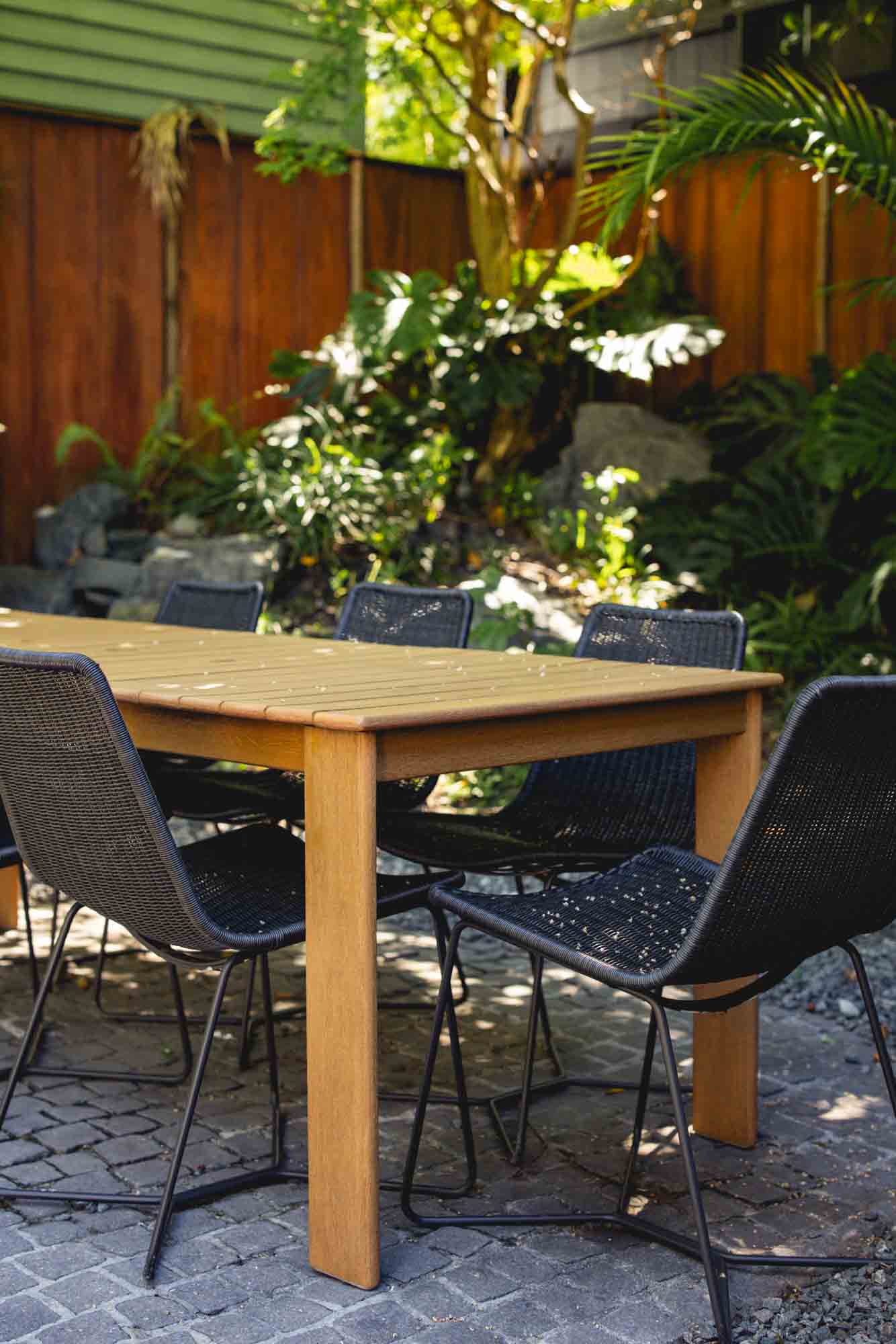 private garden area surrounded by lush greenery—an exclusive Key West sanctuary for relaxation