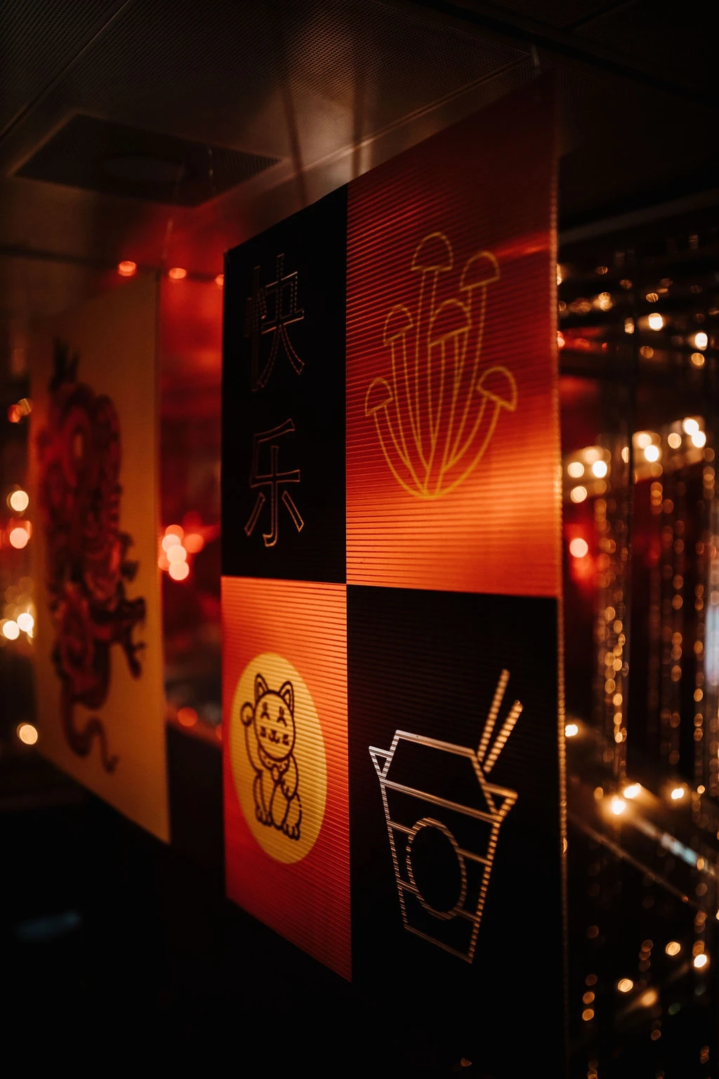 Streetside billboard with flyposters of the Batch.Works brand and illustrations