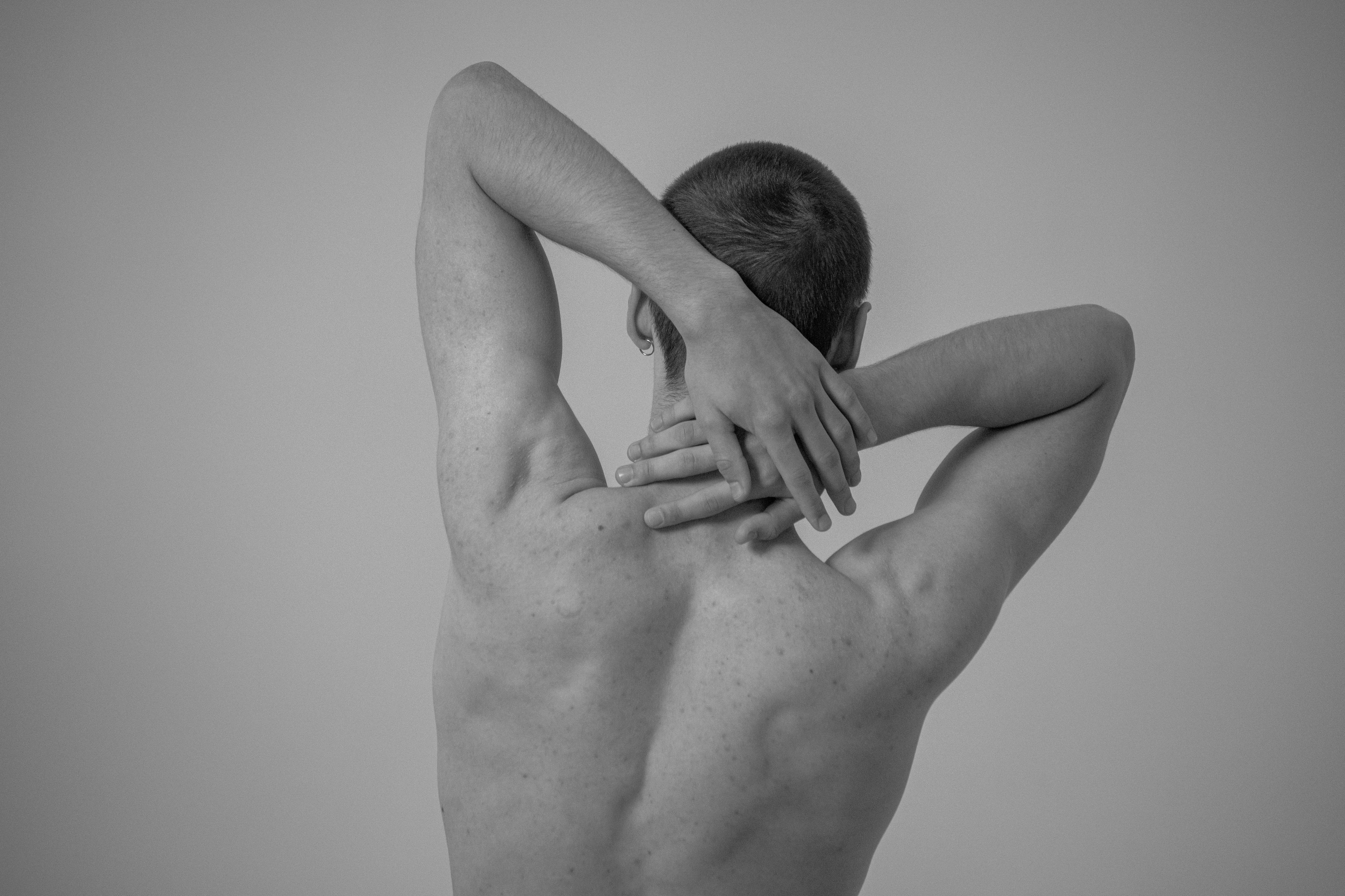 a man with his hands on his chest