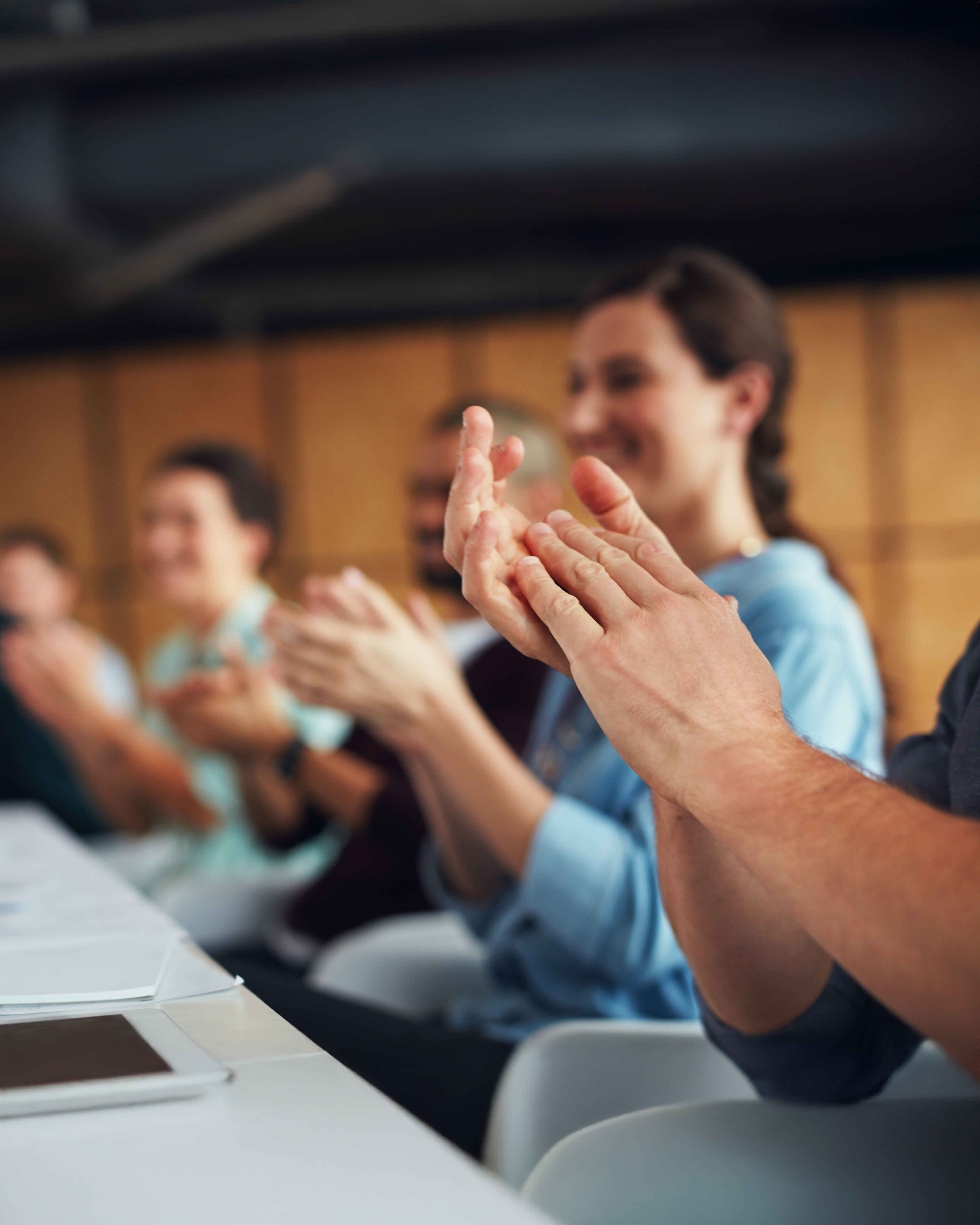 People gathered clapping hands