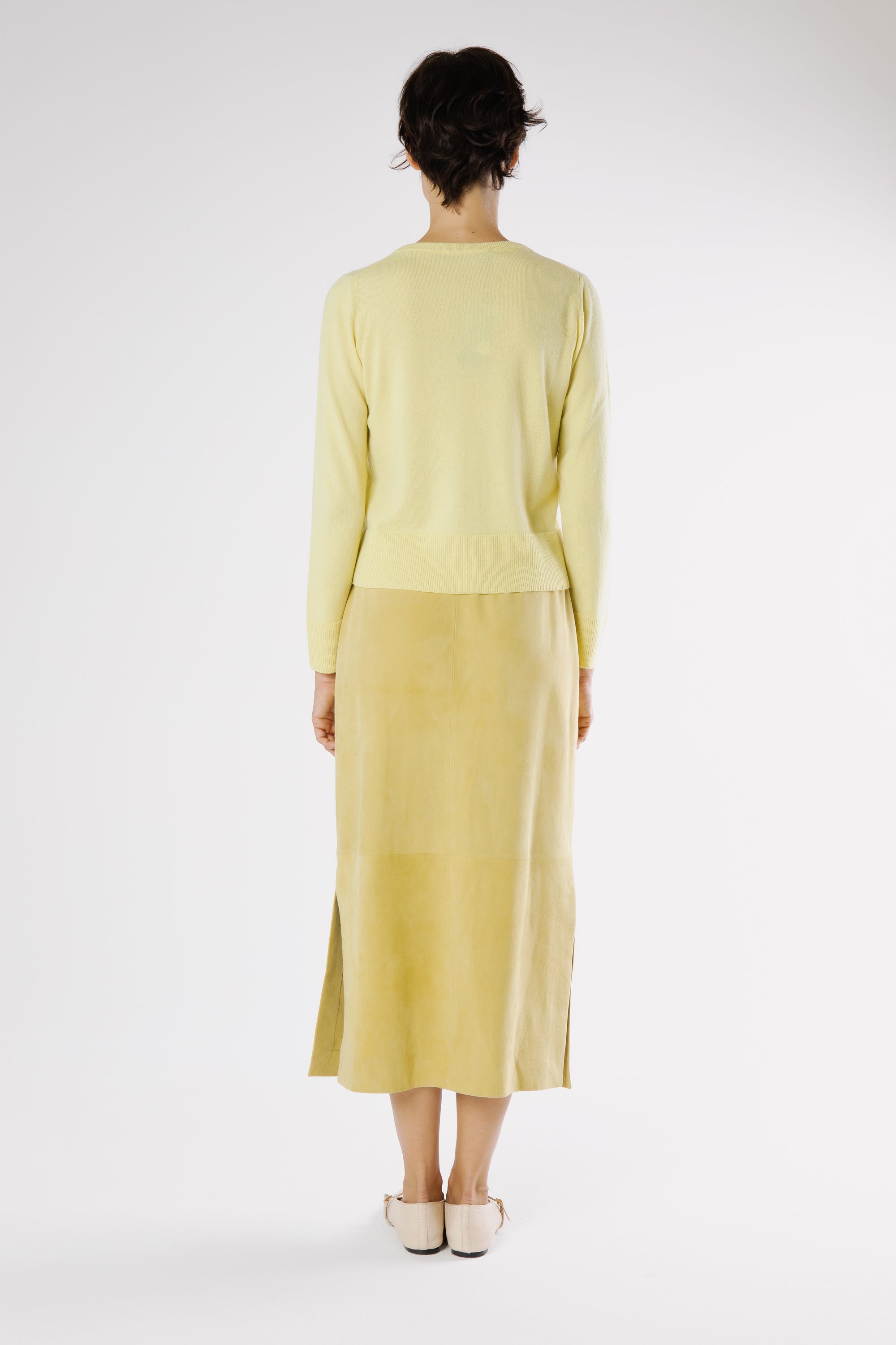Lemu suede midi skirt showing soft drape and natural movement from the back