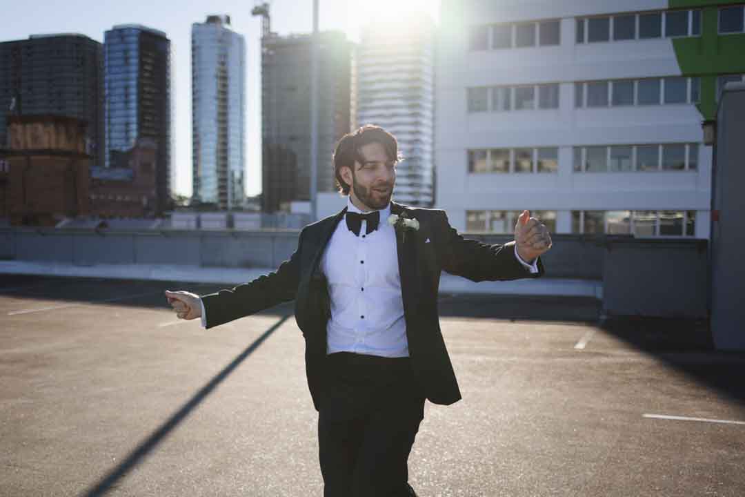 Groom dancing on car park roof