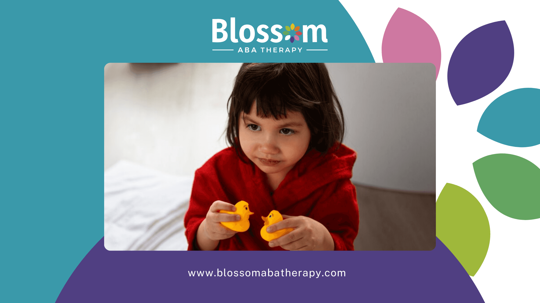 A little girl holding two toy ducks while smiling