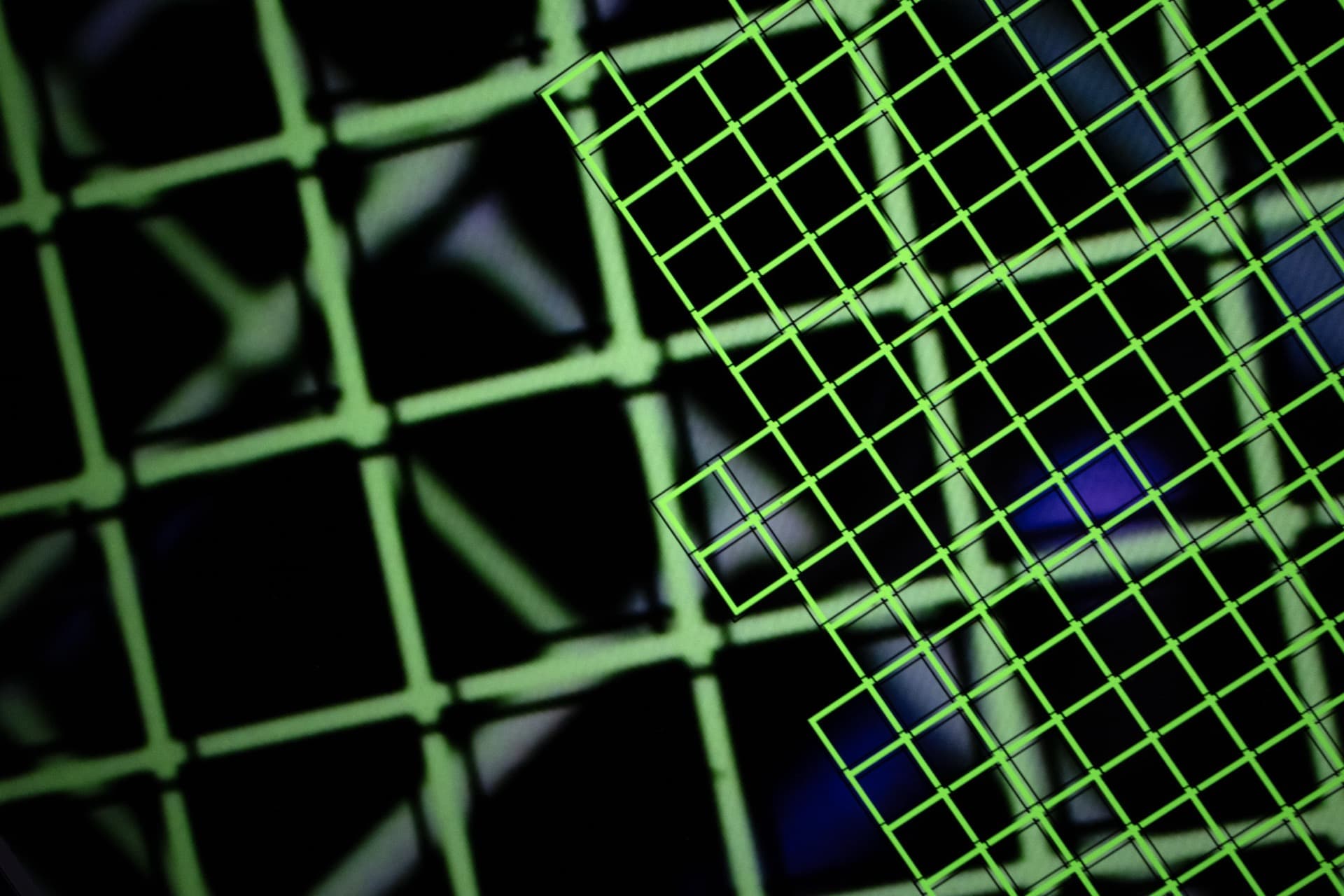 Overlapping autofocus grid pattern with purple light artifacts visible through transparent detection boxes, diagonal composition showing multiple focus zones