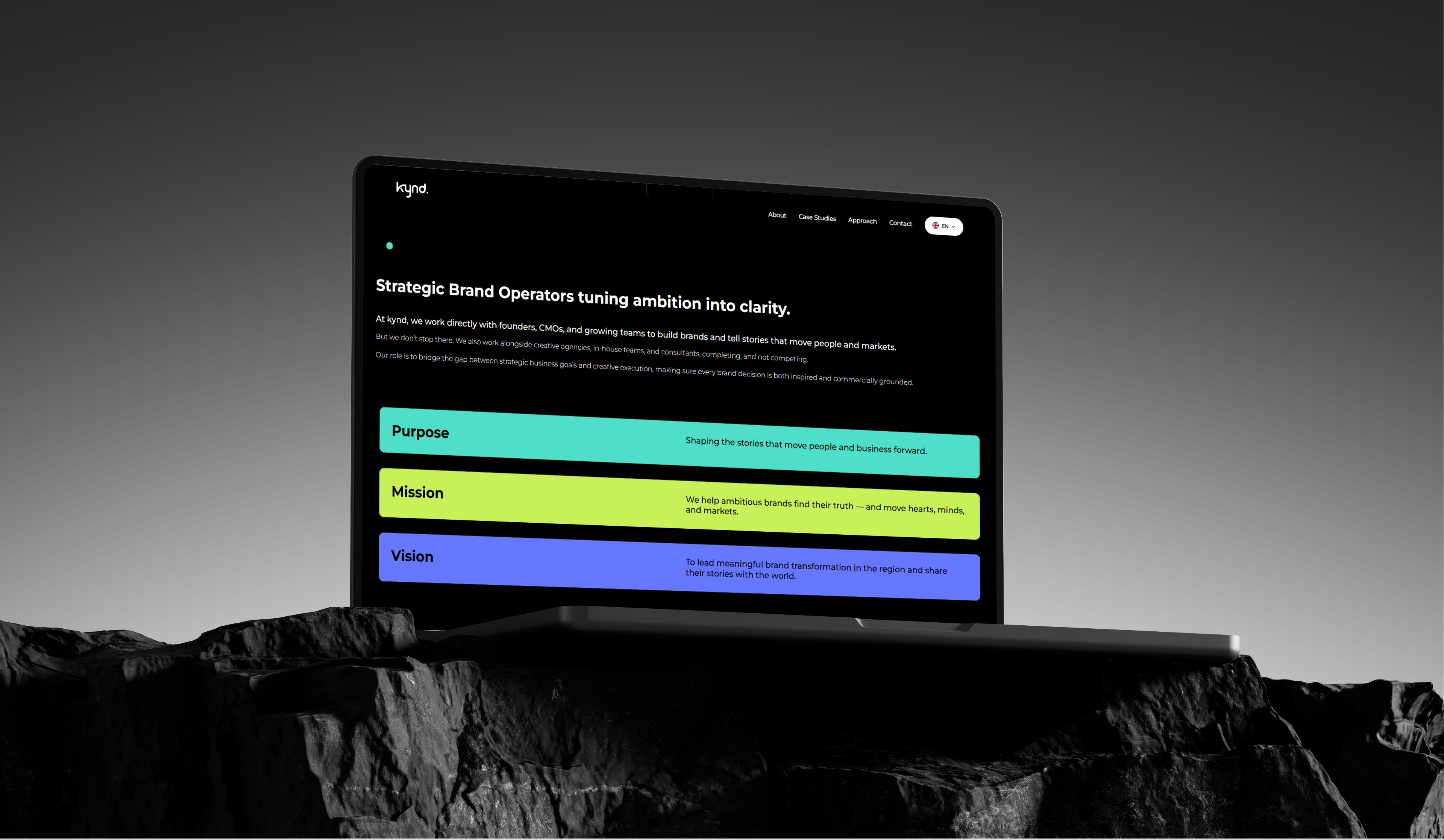 Laptop displaying a website with sections for Overview, Resources, and Videos, all against a dark background.