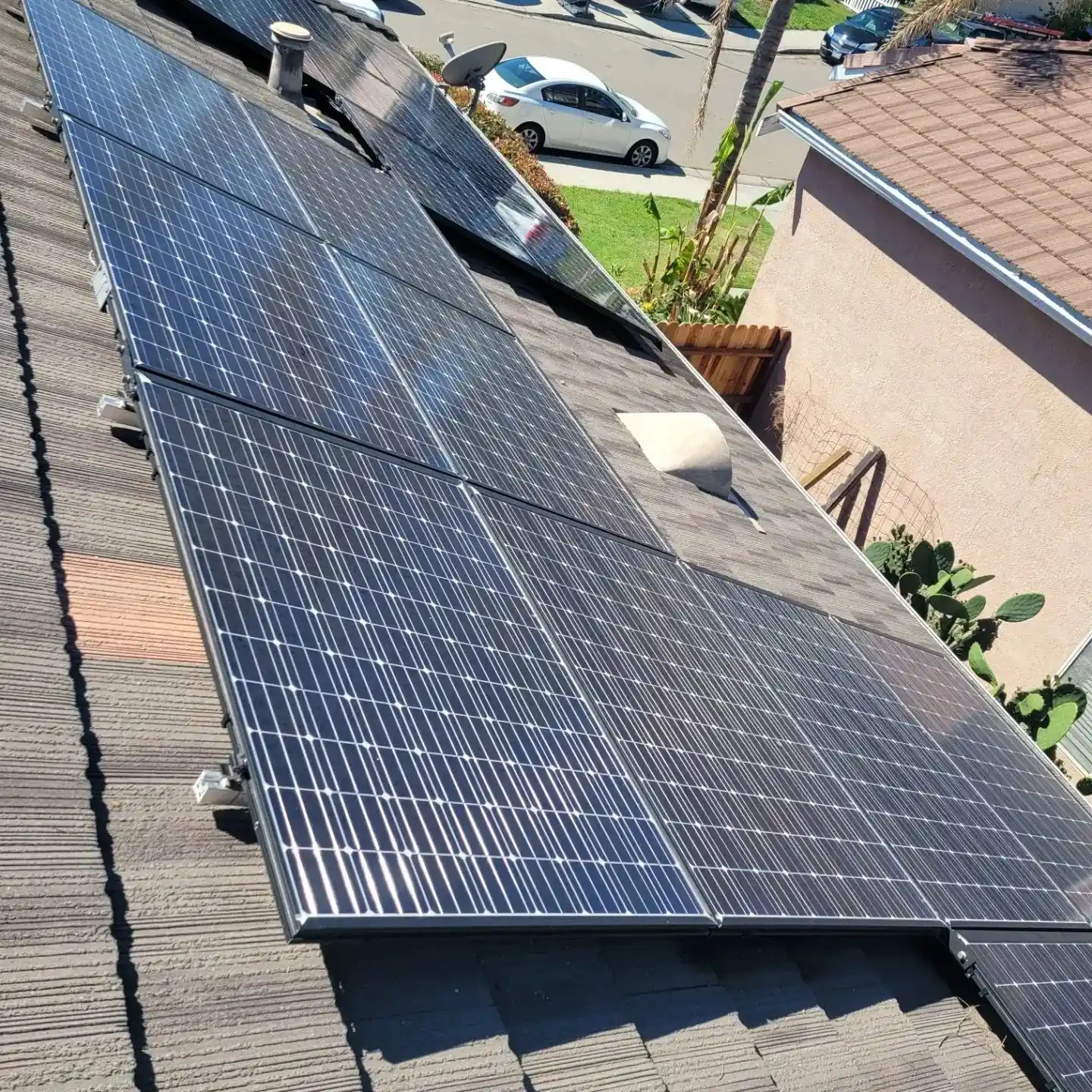 Residential solar array on a tile roof after cleaning | Premier Solar Service, serving Central Valley, CA