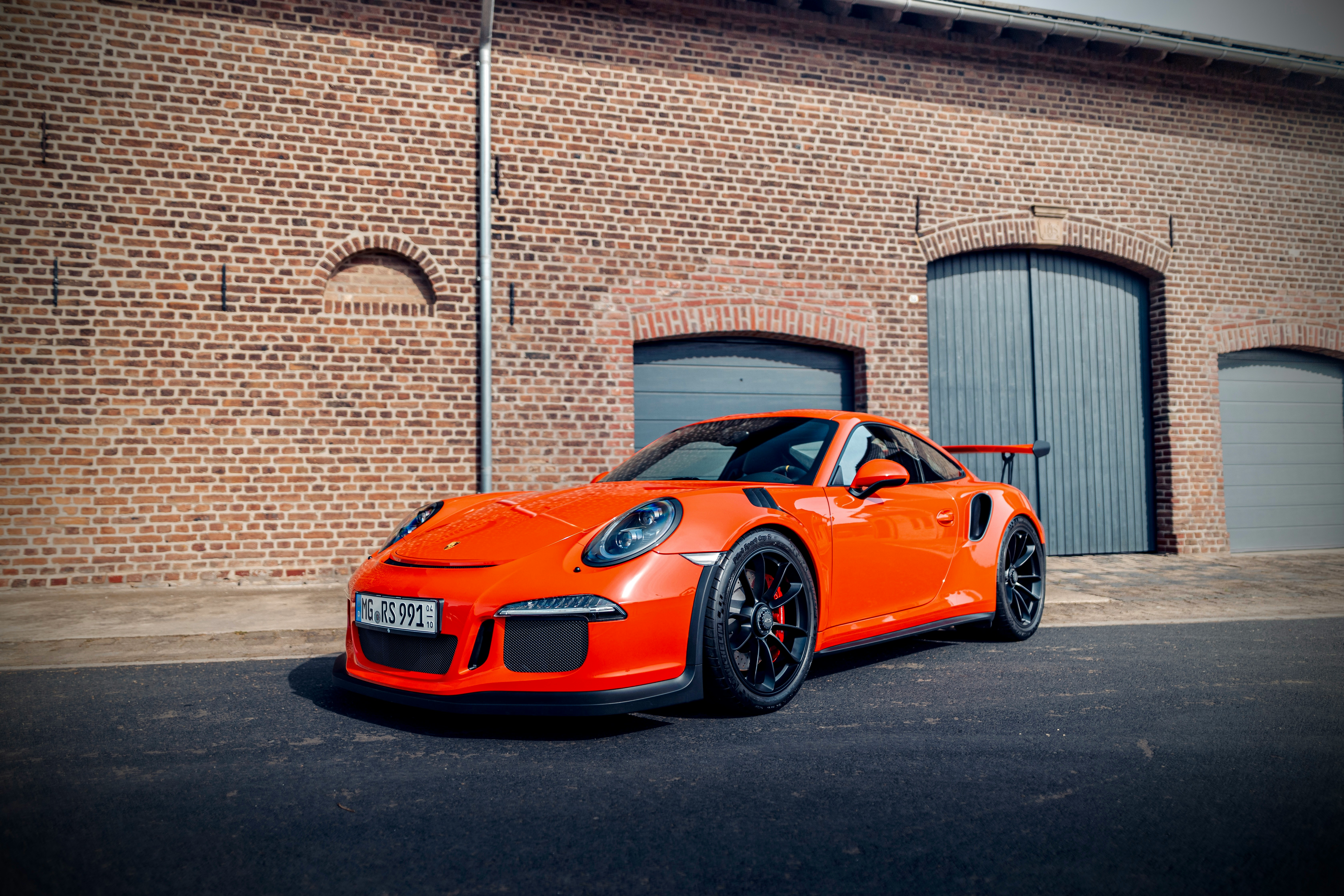 Orange performance coupe parked