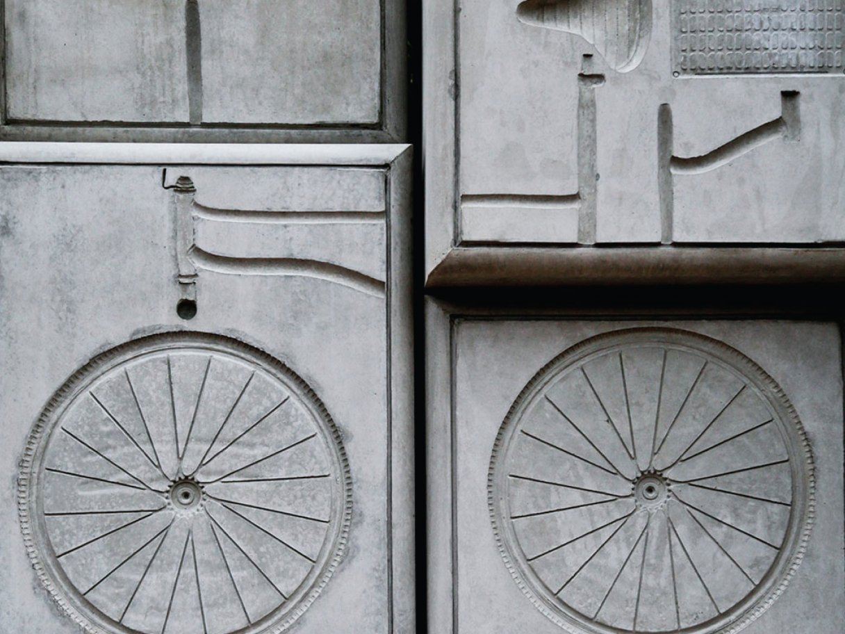 Rustic cabin in a golden field at sunset