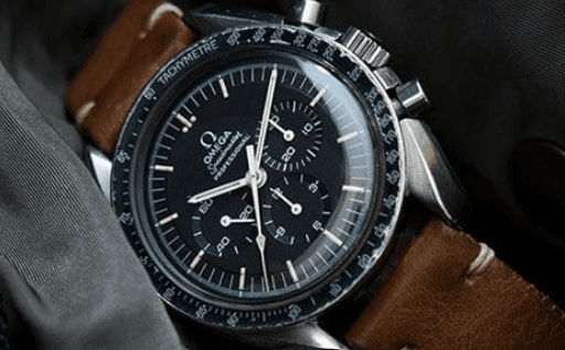 A close-up of a large watch on the dashboard.
