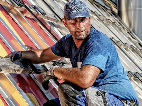 brown roof across blue sky