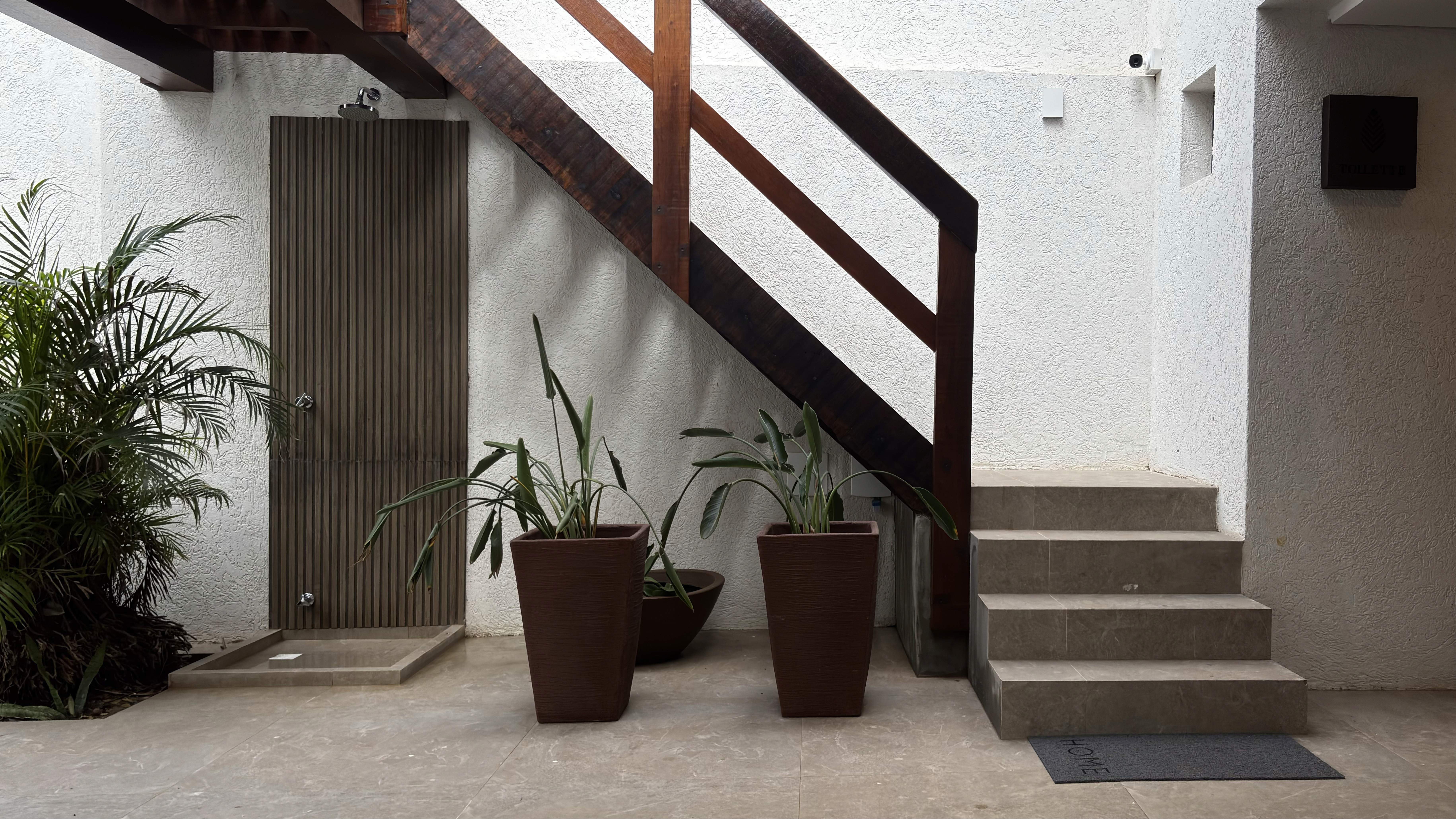 flat lay shot of spa amenities by the bathtub