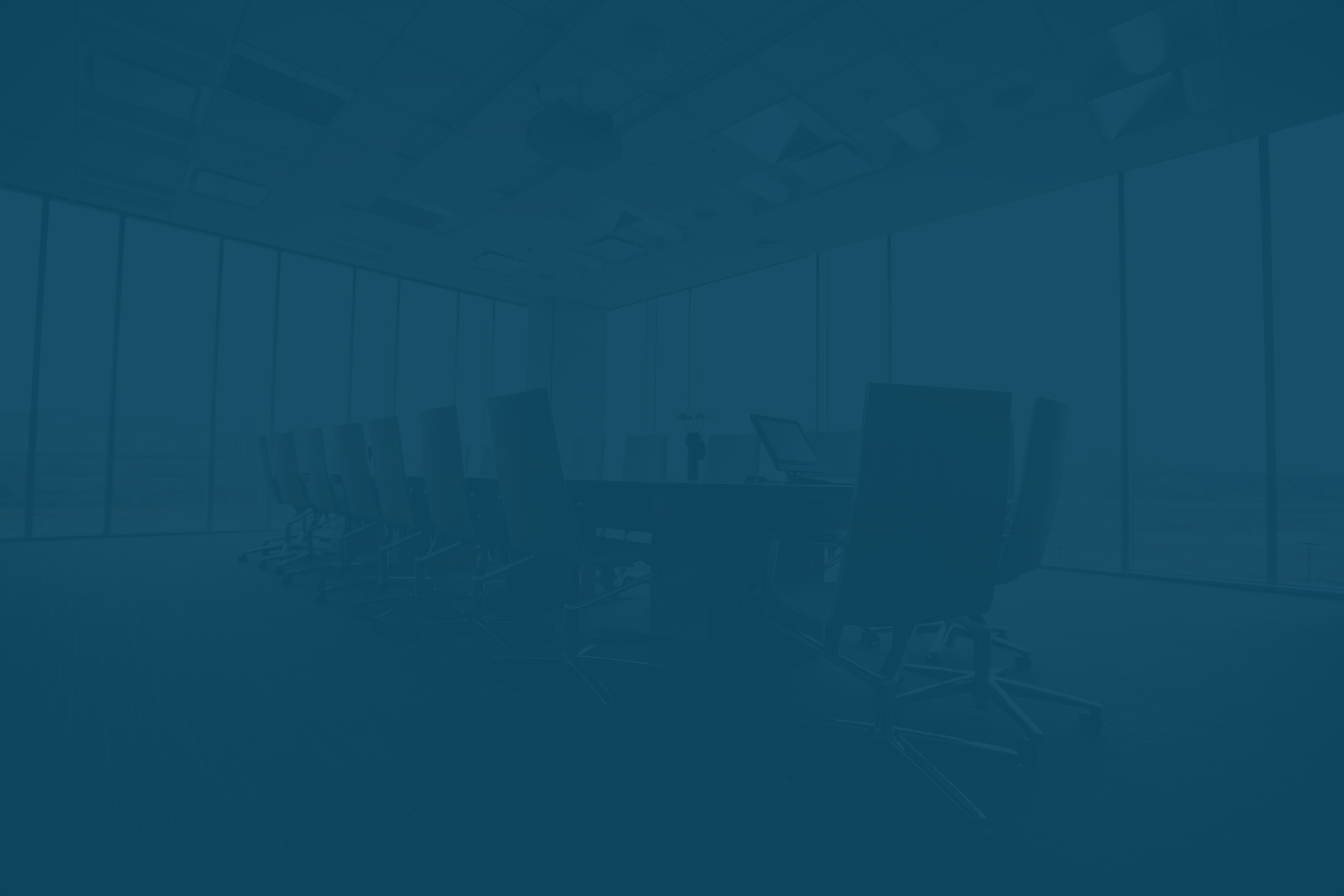 A softly blurred image of a modern boardroom, creating a professional and inviting backdrop for the call-to-action section.