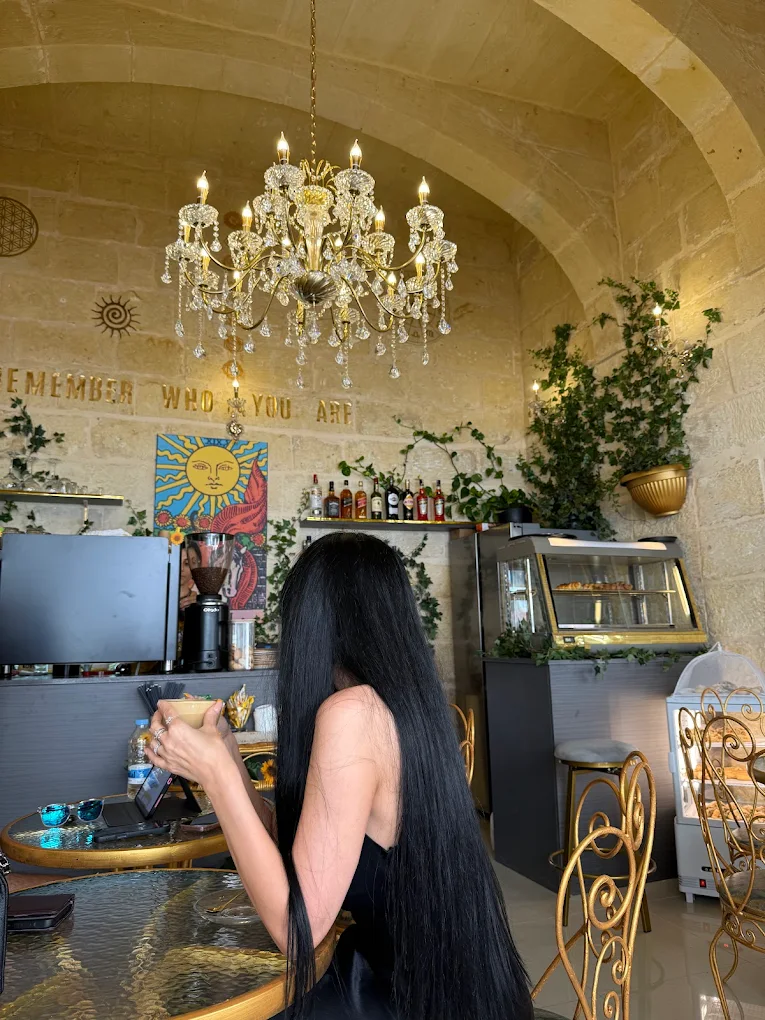Barista pouring milk into latte with art