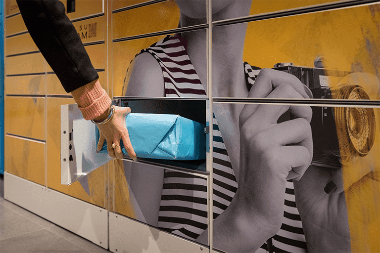Consumer using parcel locker to collect online purchase