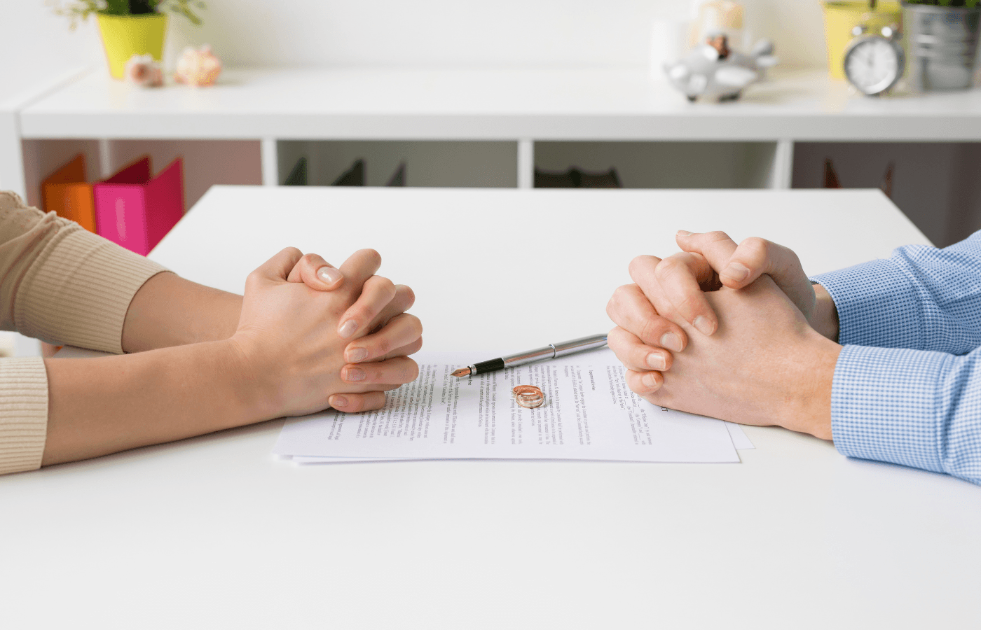 Couple going through divorce signing papers