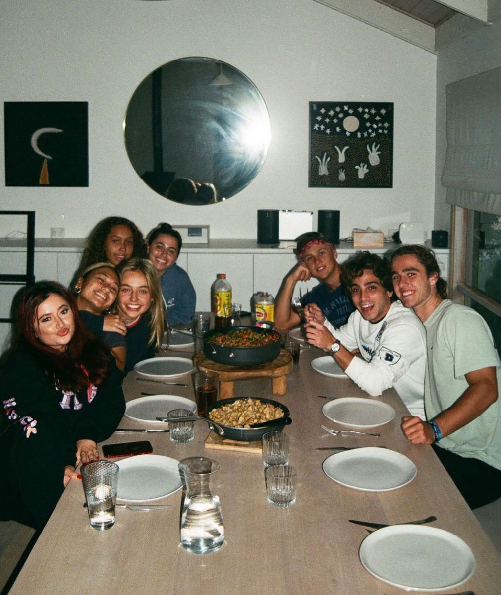 people walking on sidewalk near high rise buildings during daytime