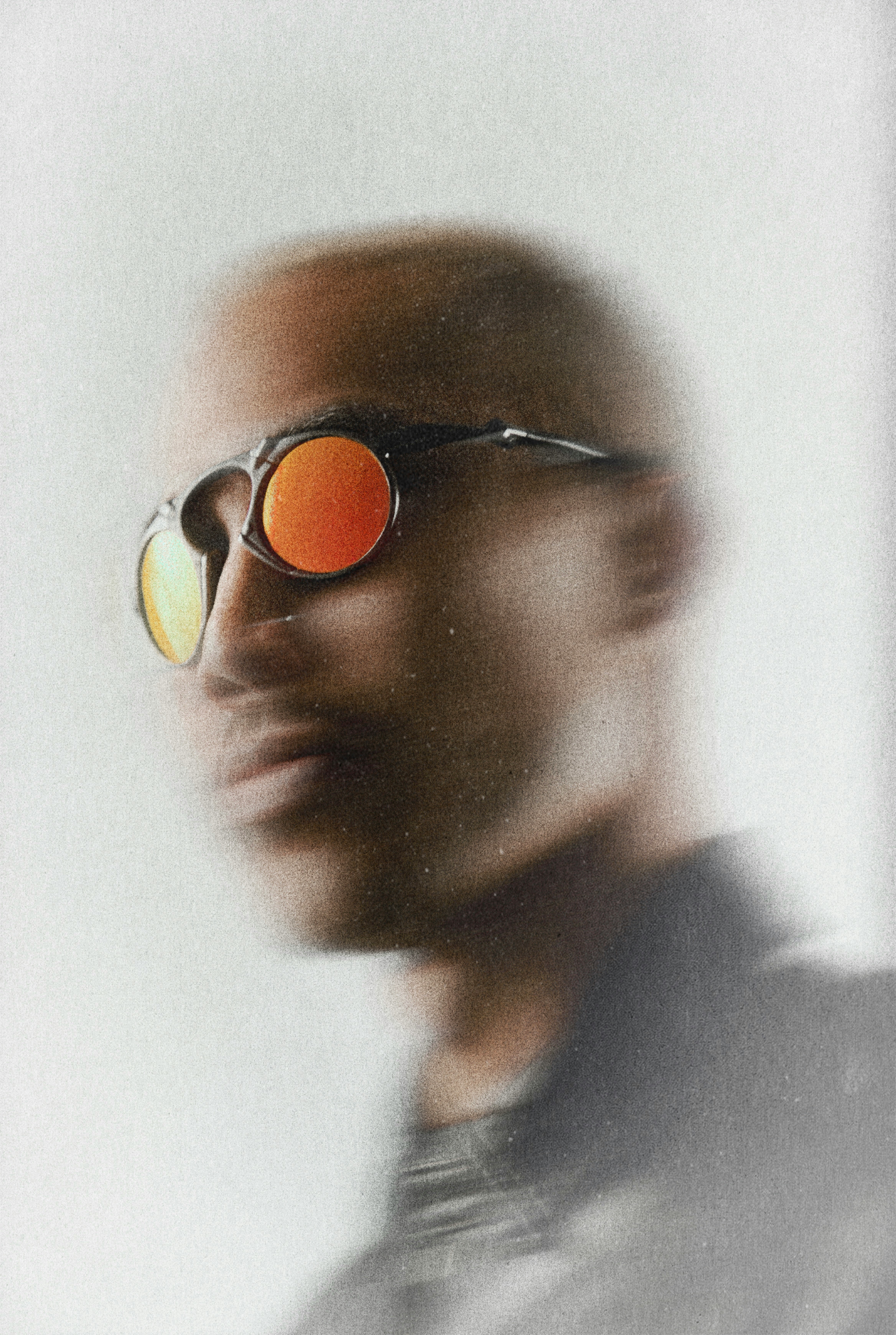 Man wearing sunglasses with orange lenses