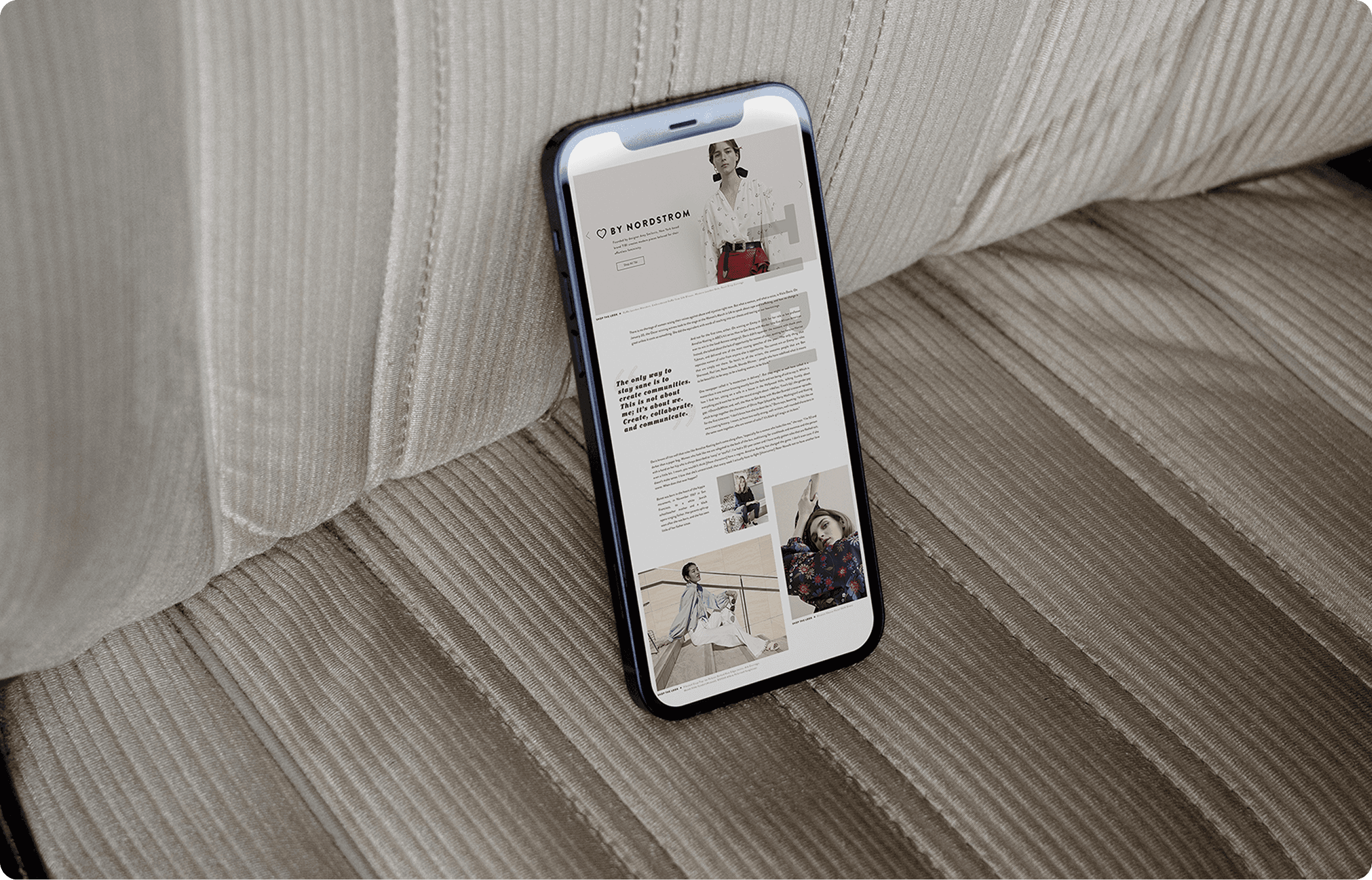 Hill country living room with cognac leather sofa, exposed wood beams, and open concept kitchen with sage green cabinets