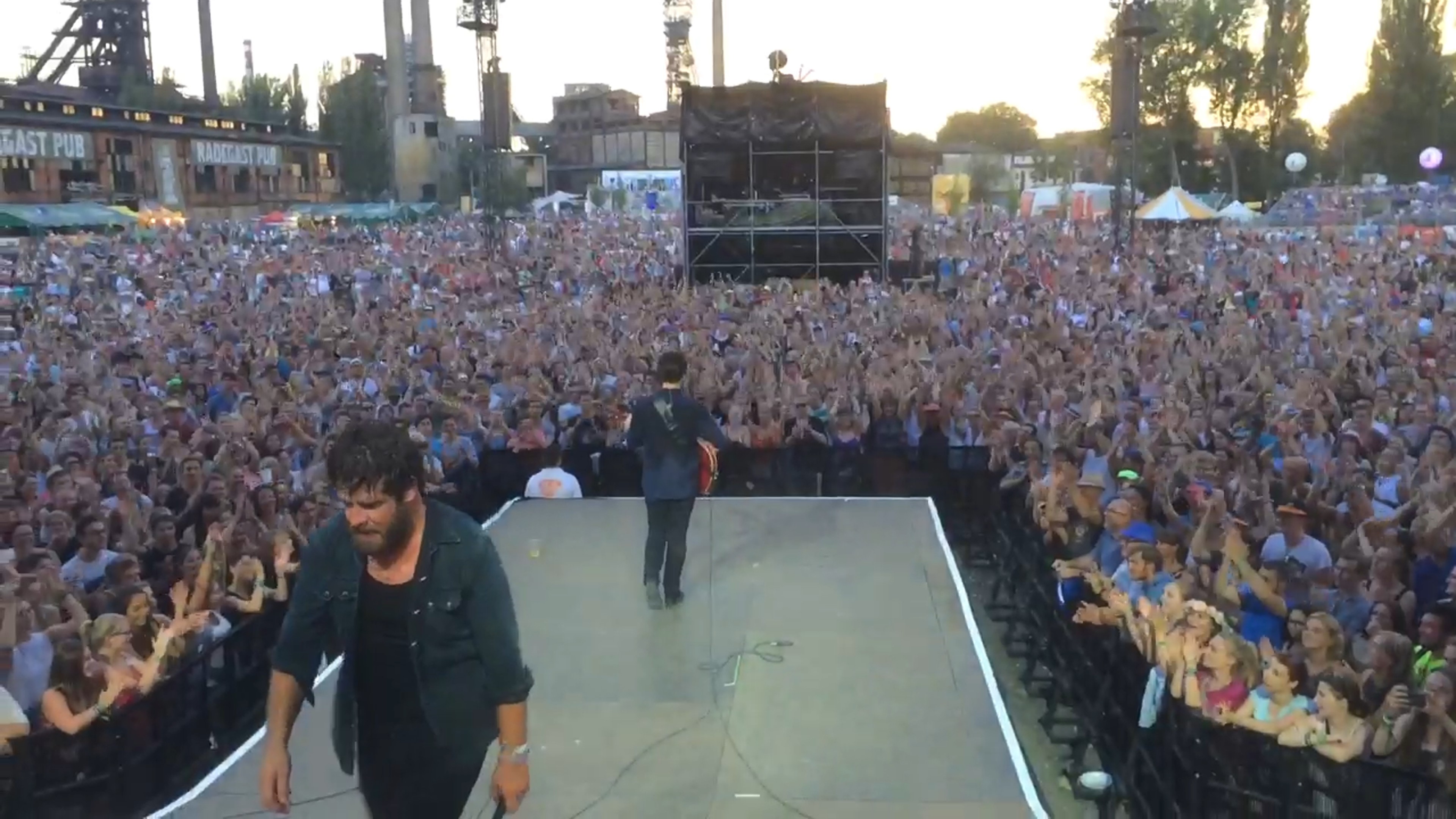 Streetside billboard with flyposters of the Batch.Works brand and illustrations