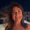 a woman in a pink dress posing for a picture
