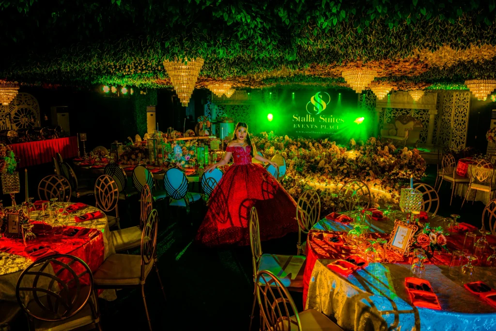 Debutante in red among the candlelit tables of Pandora Hall, Quezon City