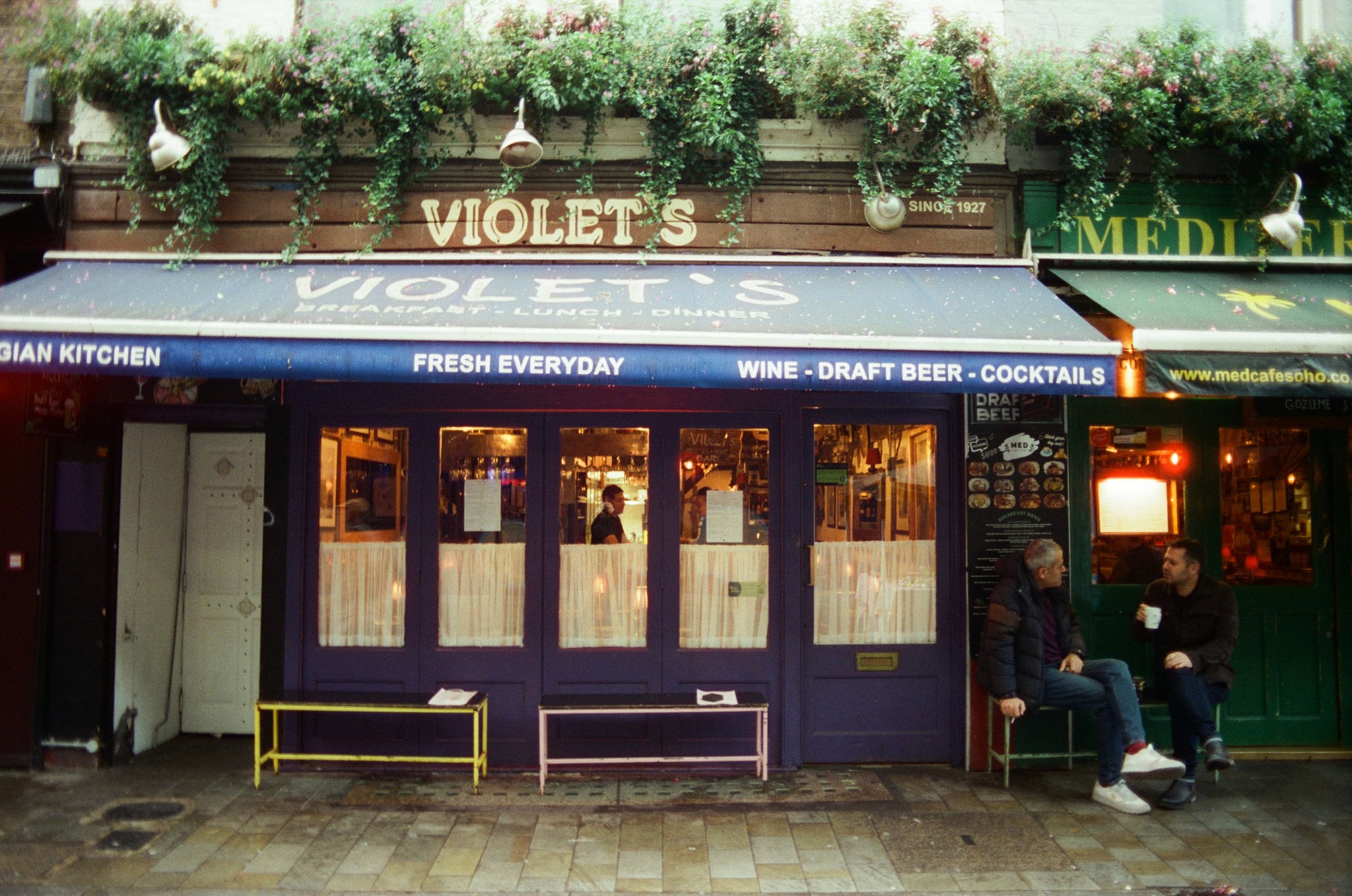 Modern skyscrapers line a busy highway in a sprawling city.