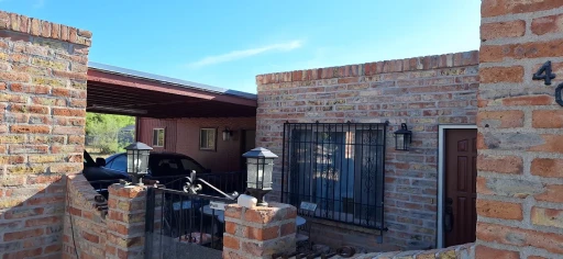 Brick home with covered patio in Tucson