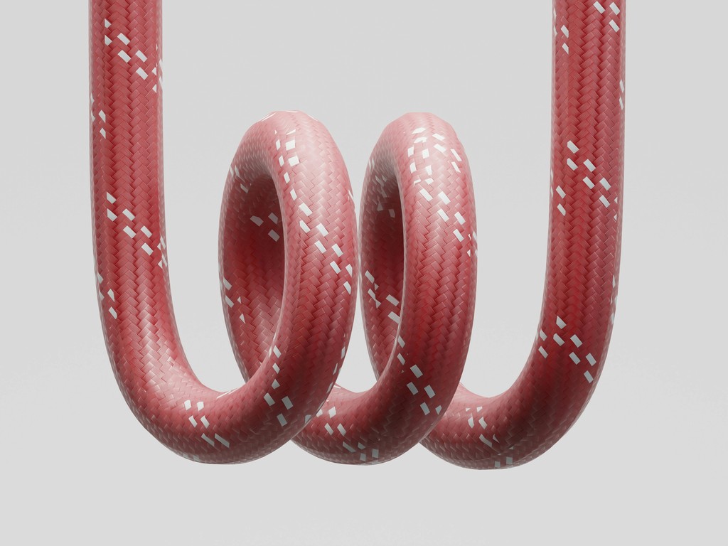Red rope coiled in a spiral shape.